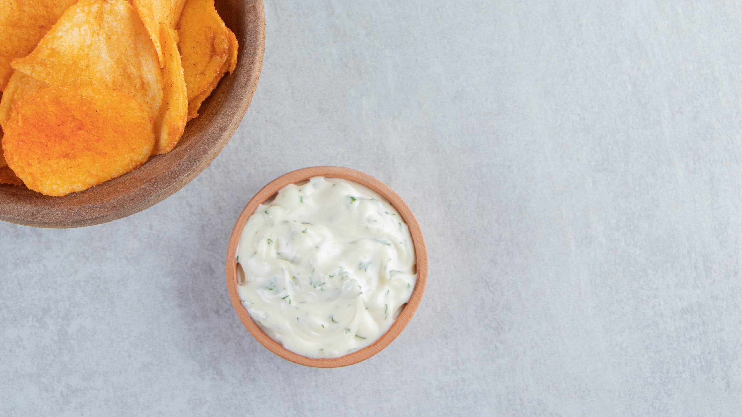 A bowl of spicy chips with Captain D's tartar sauce