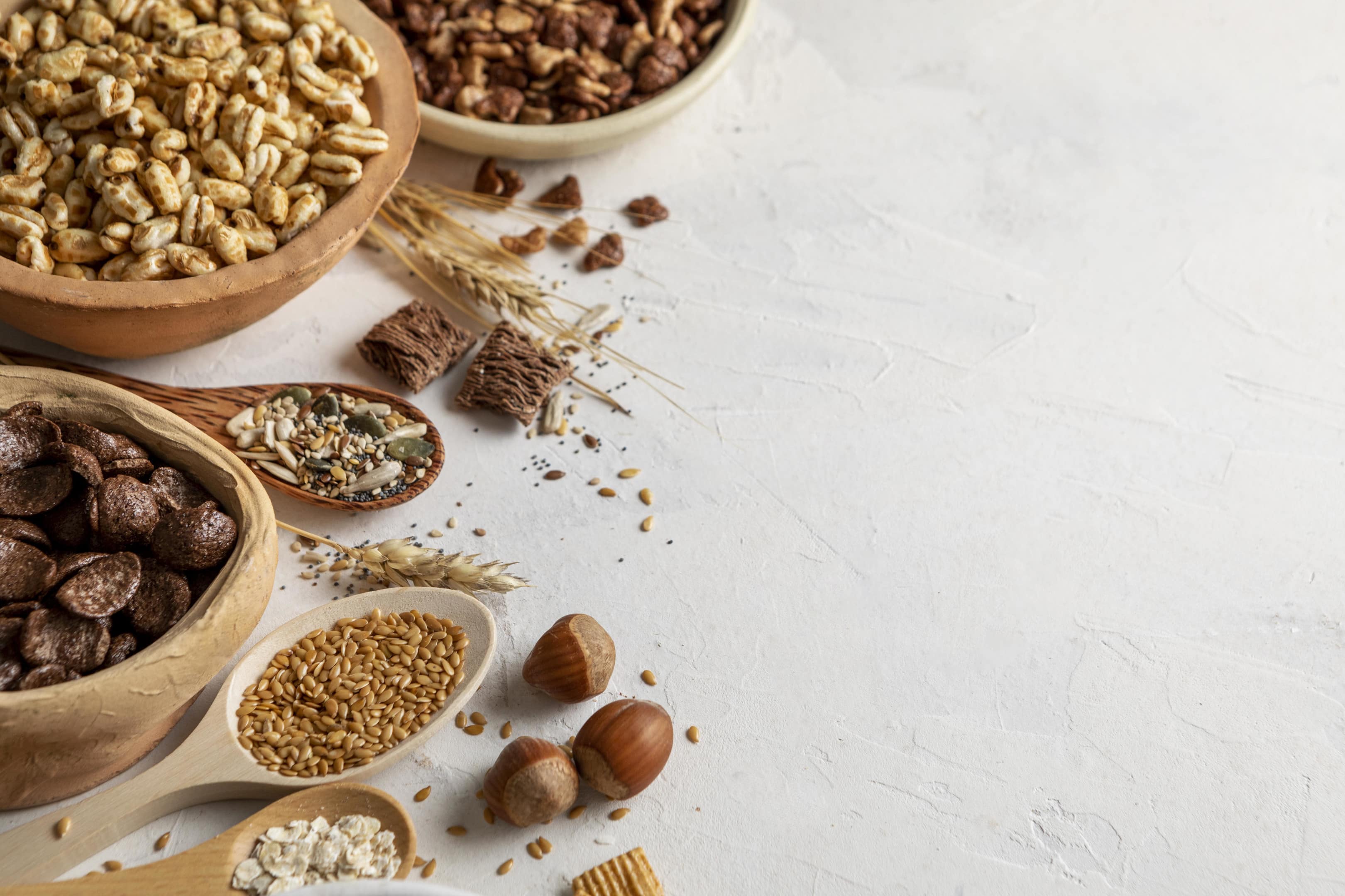 Bowls with breakfast cereals on wooden table