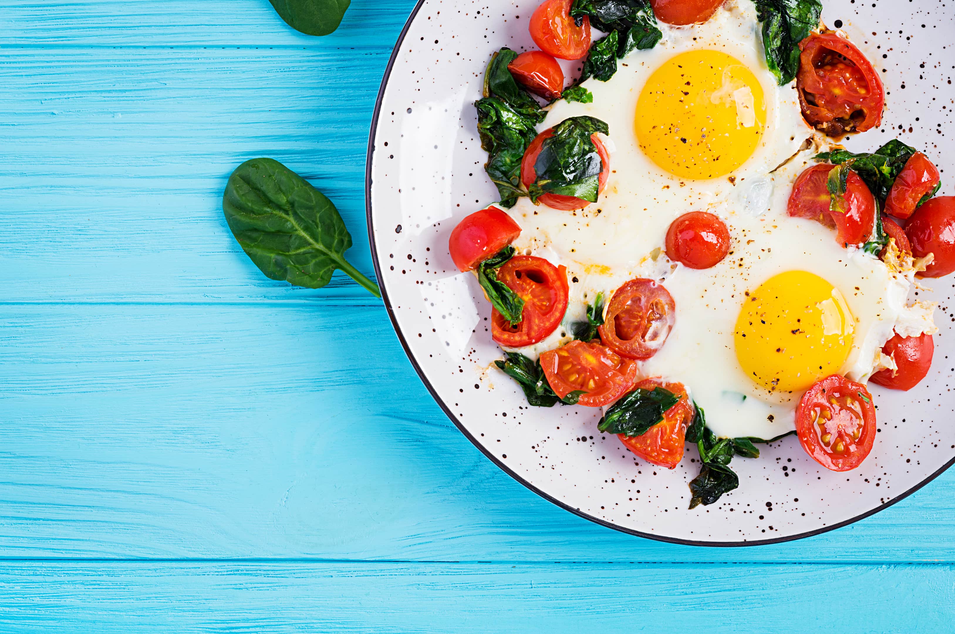 Fried egg, spinach, and cherry tomatoes