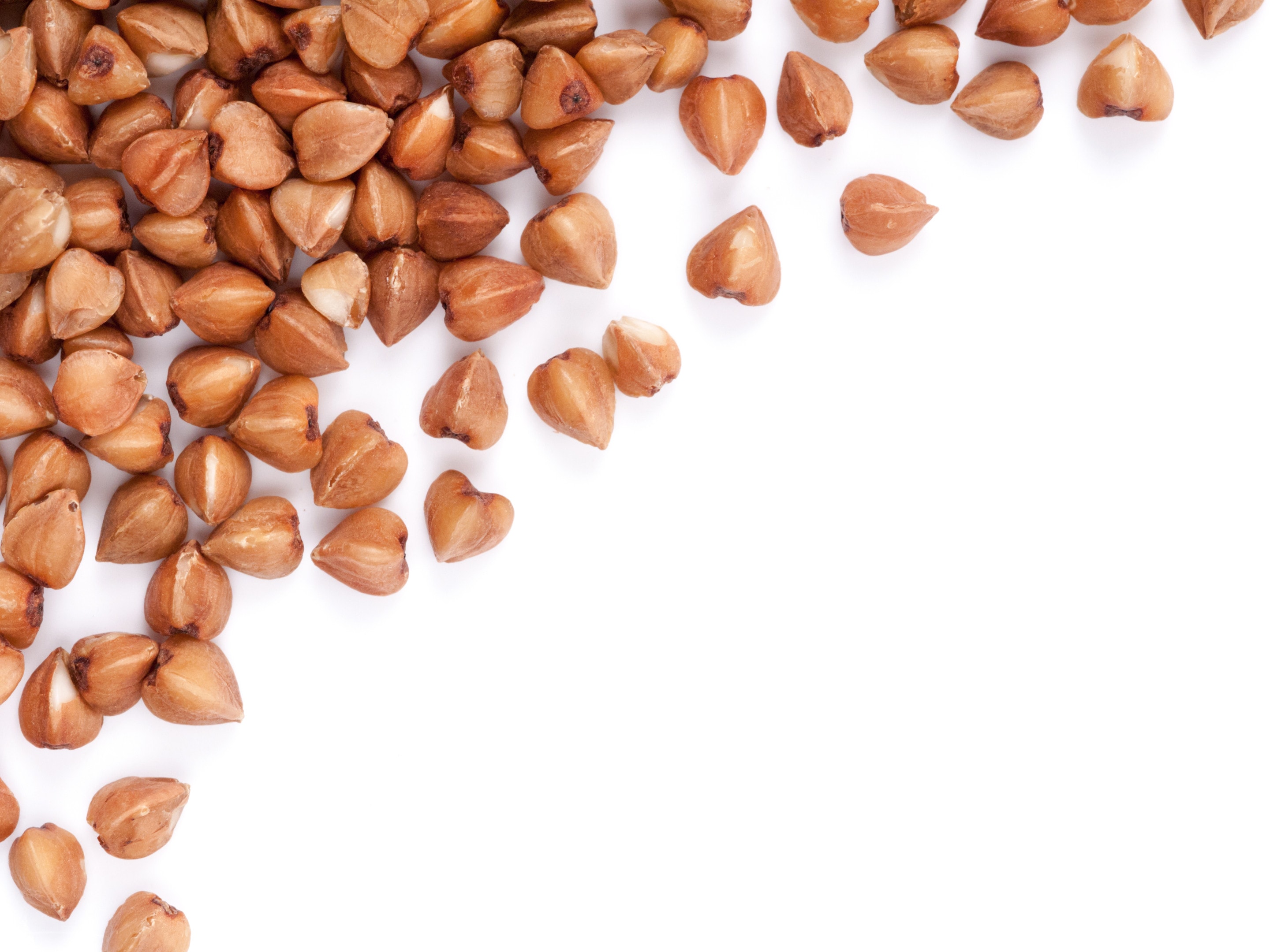 Buckwheat grains on isolated white background