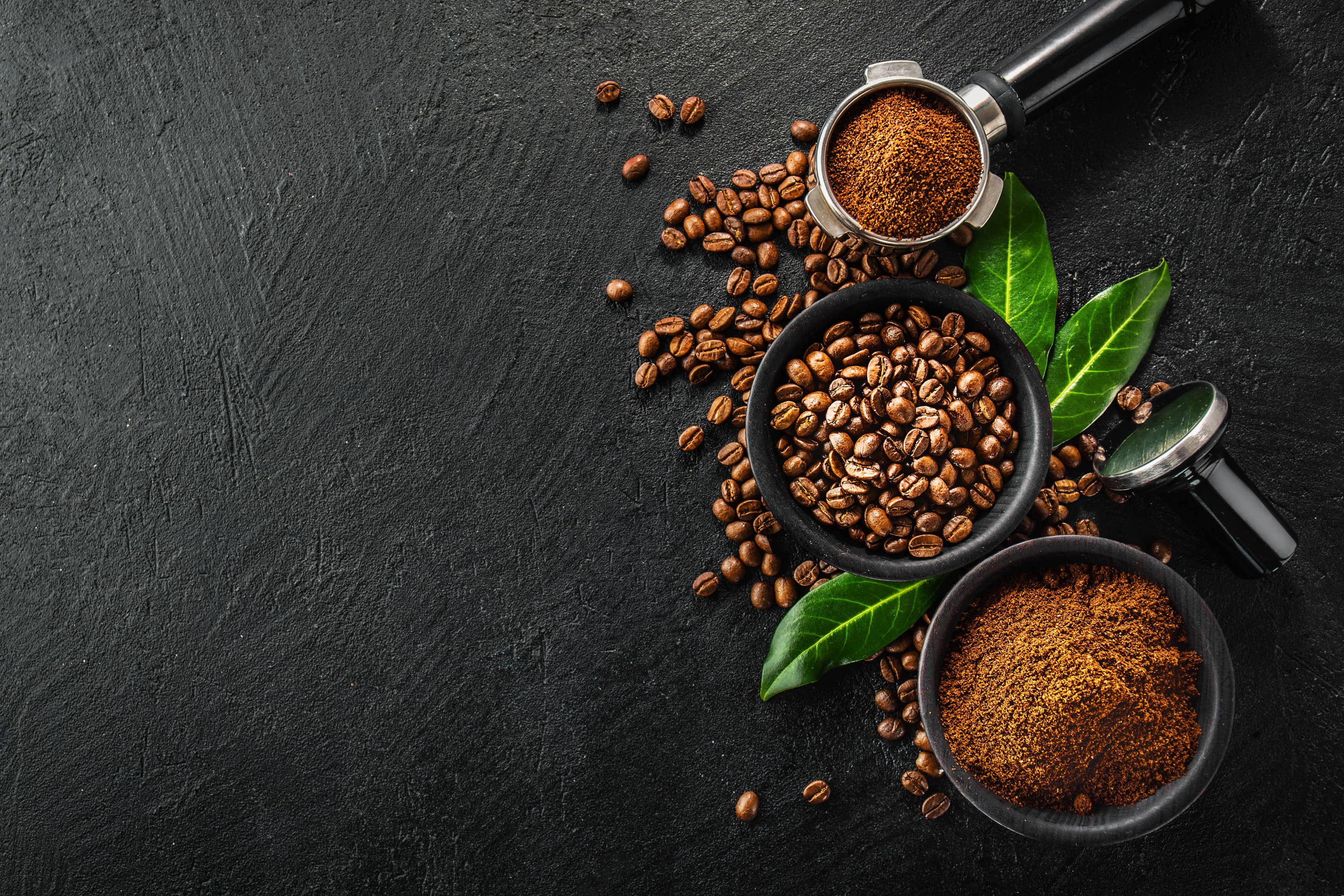 Coffee beans and powder with props of making coffee