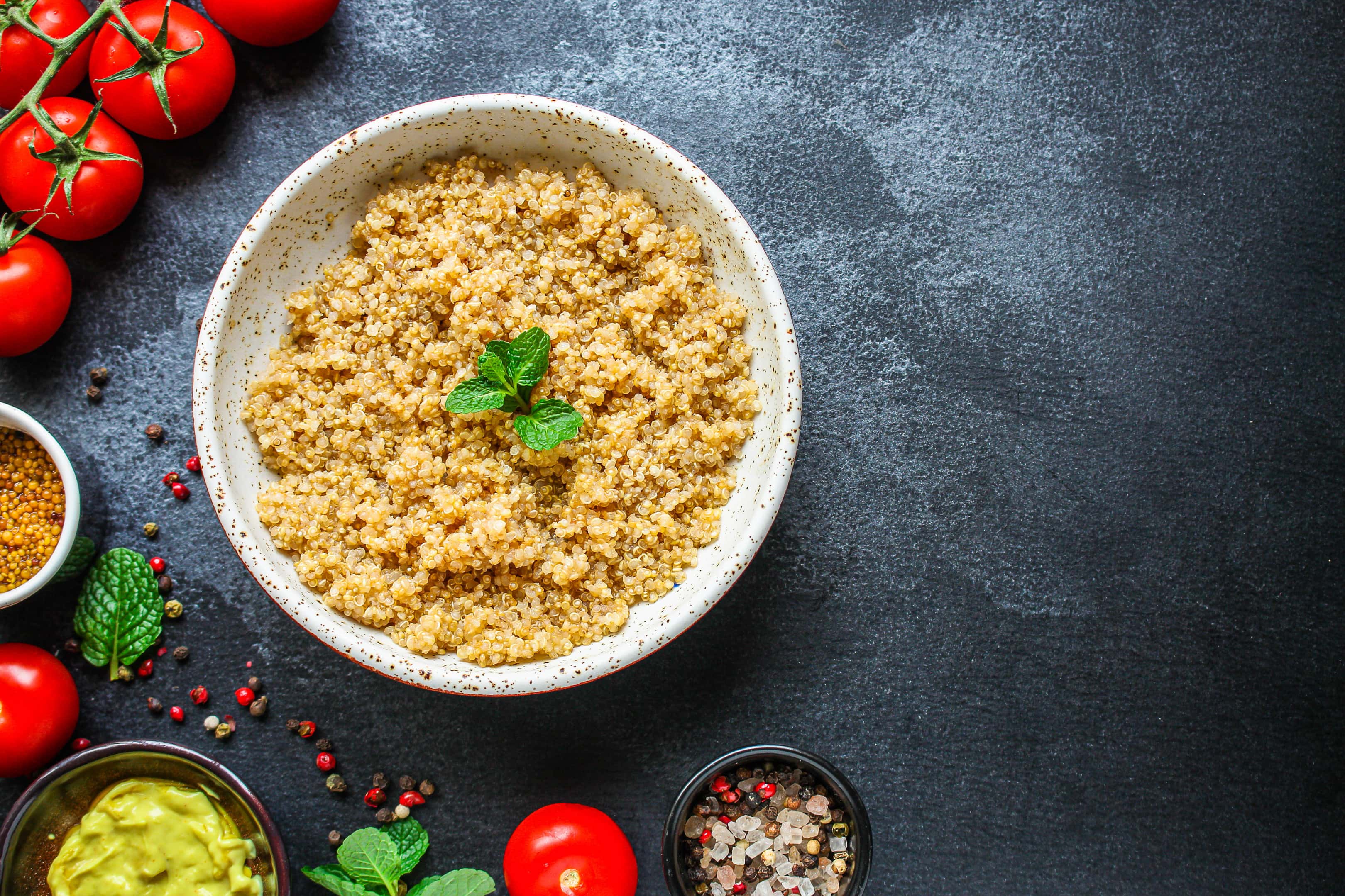 Cooked boiled quinoa in ceramic bowl