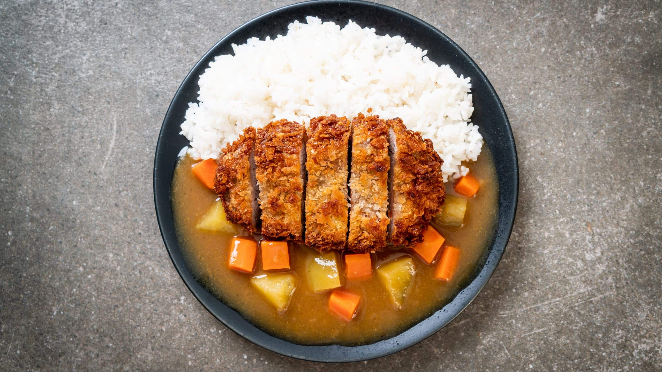 Crispy fried chicken cutlet with Coco's curry and rice