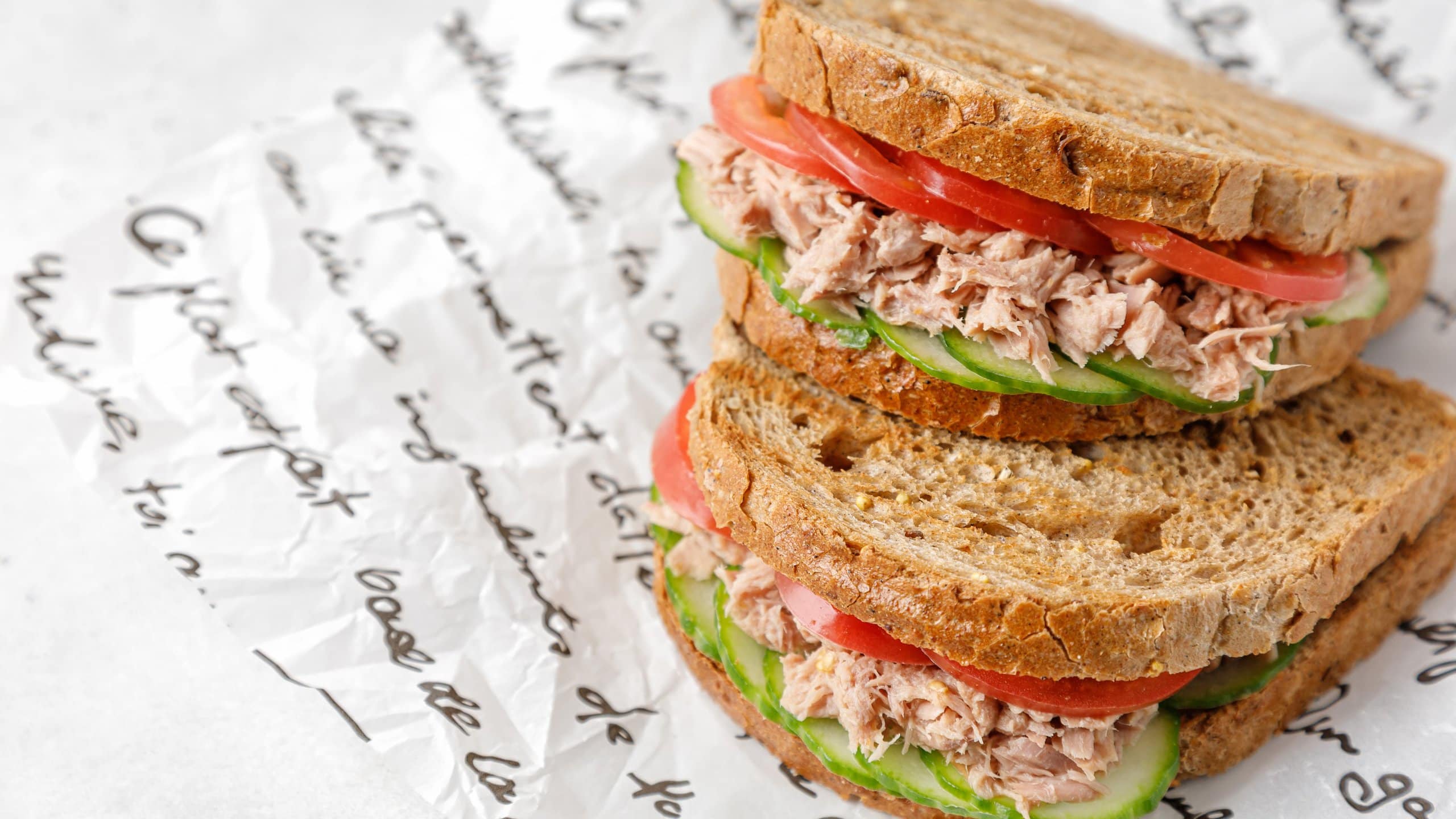 Delicious Panera tuna salad sandwiches with tomato and cucumber