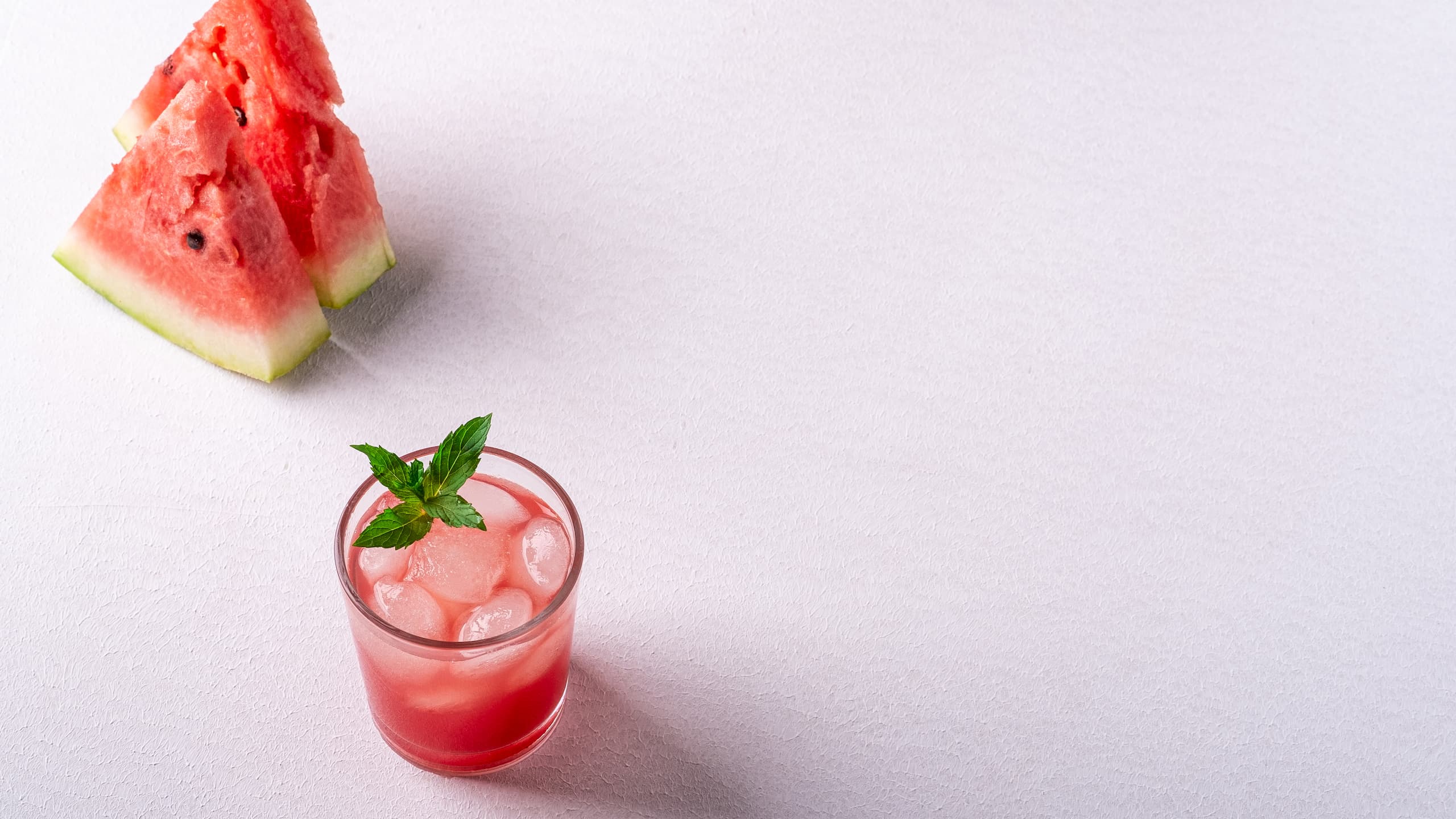 Fresh Johnny Vegas shot with ice cubes and green mint leaf