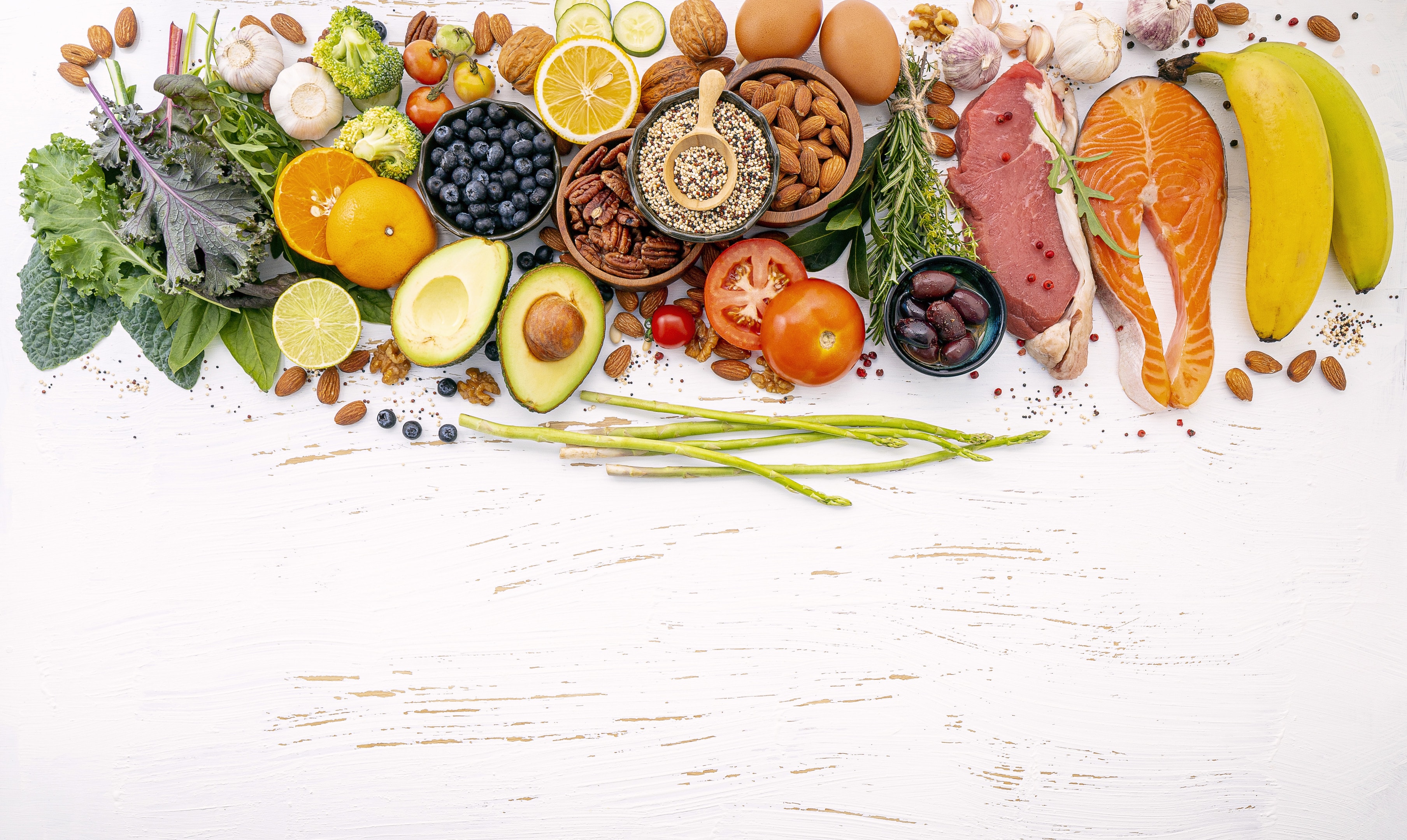 Healthy food ingredients selection on white wooden table
