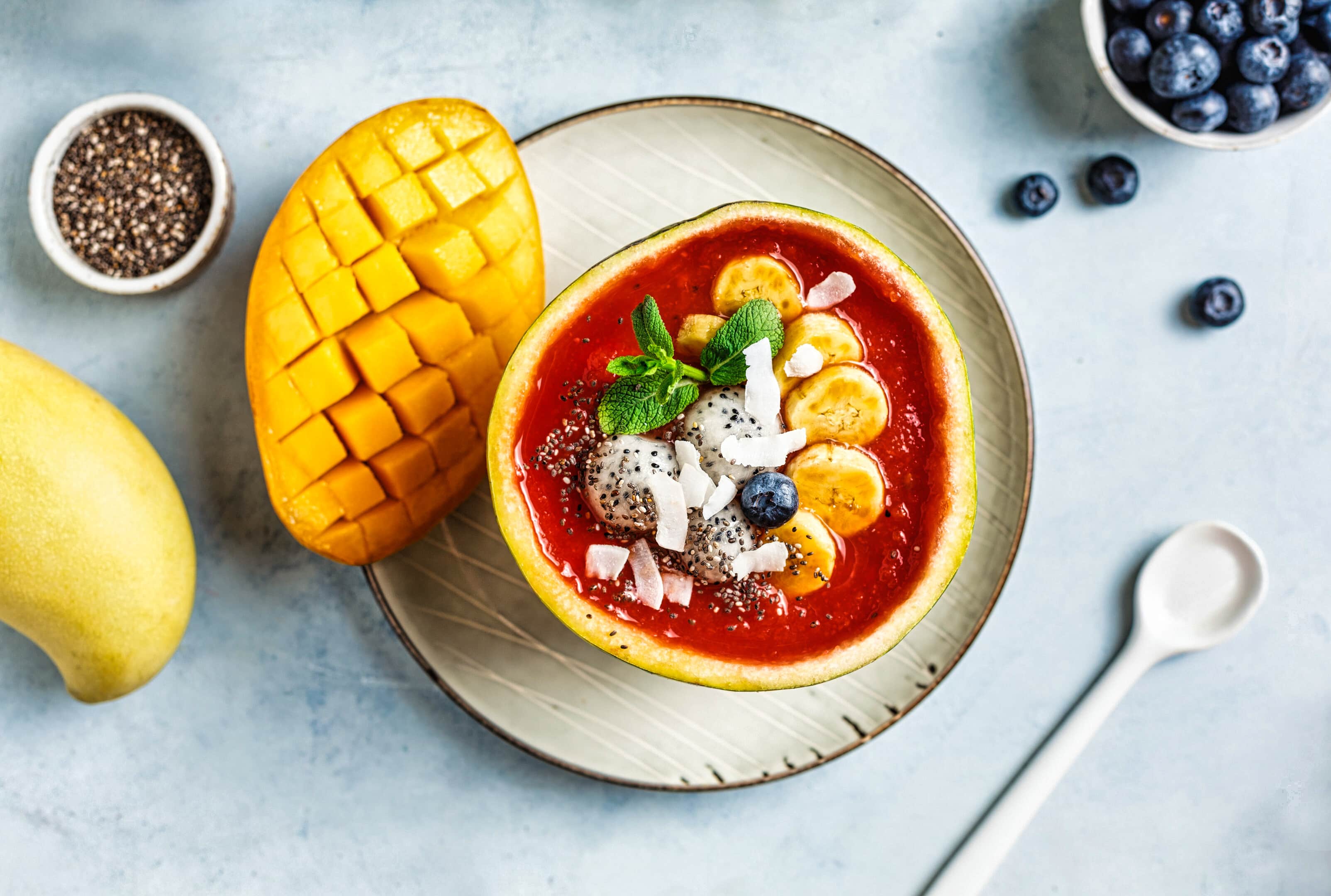 Healthy watermelon smoothie with mango, dragon fruit, banana and pineapple