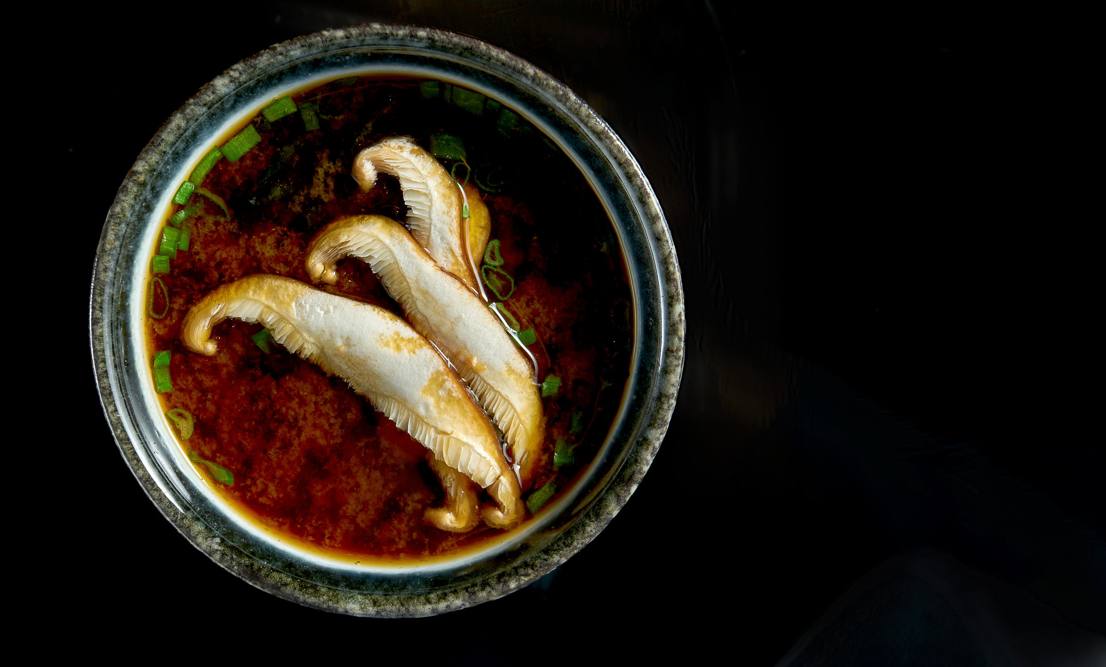 Japanese miso soup with onions, seaweed and eryngii mushrooms