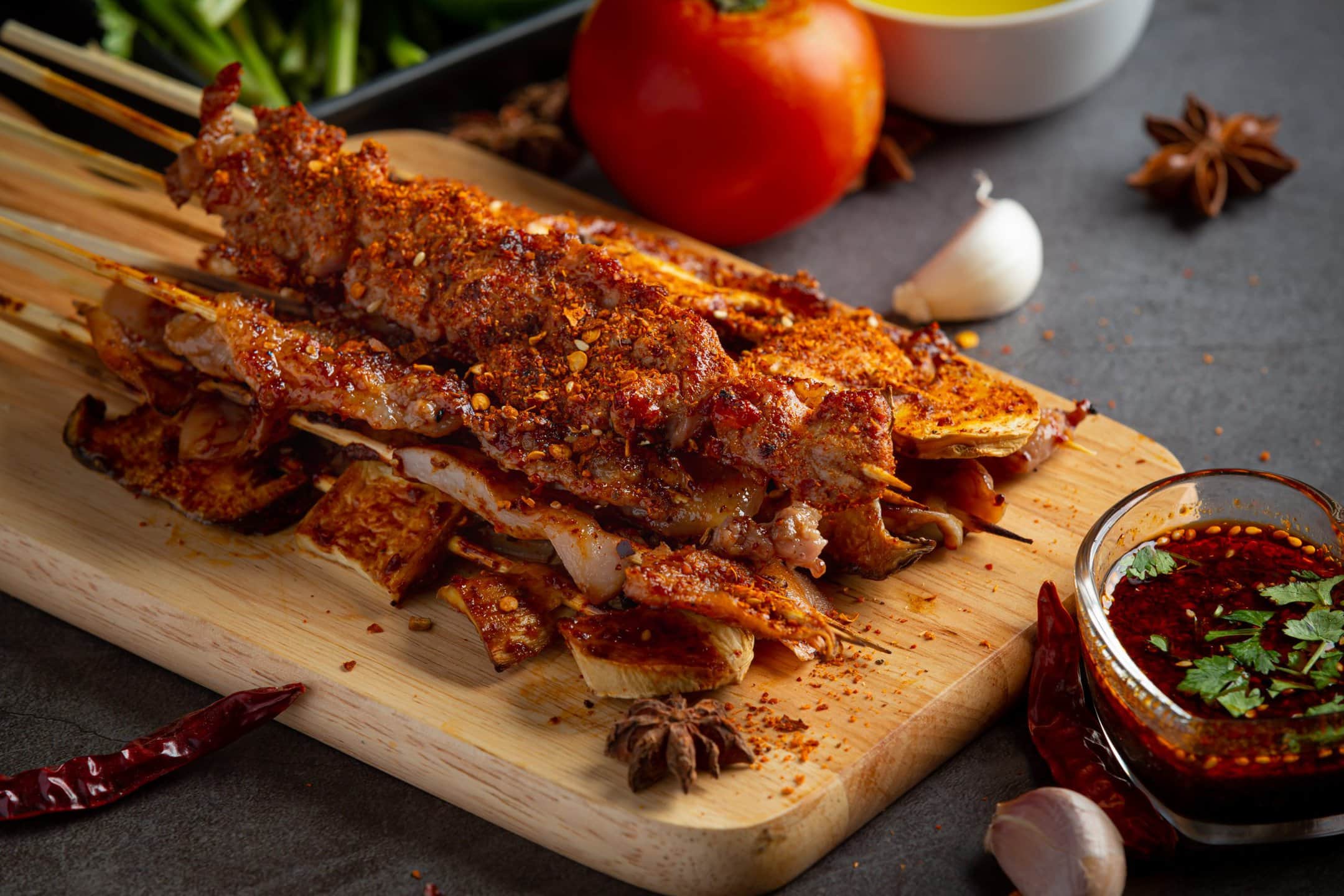 Seasoned pork riblets on skewers with dipping sauce