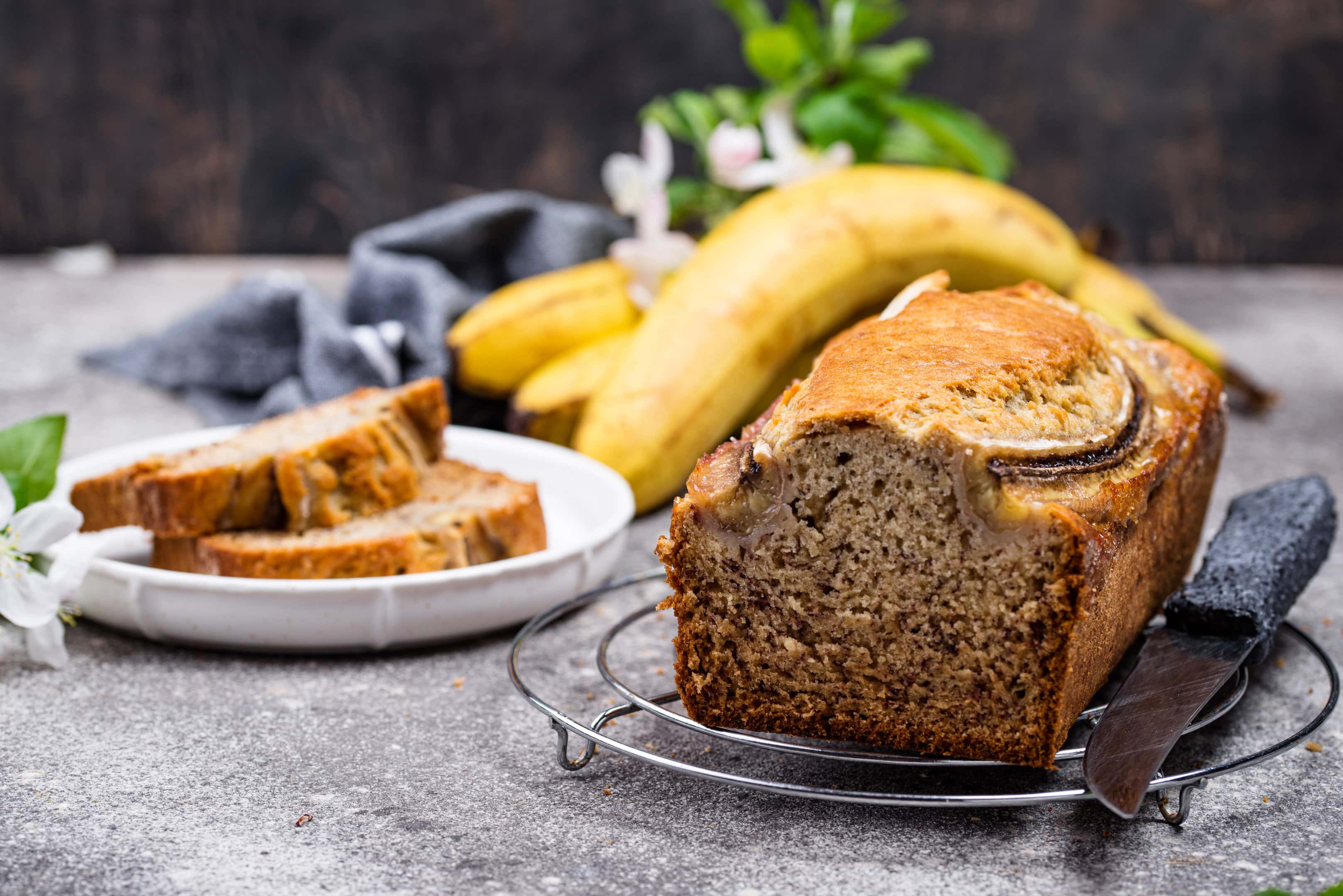 Sliced Betty Crocker's banana bread with fresh bananas