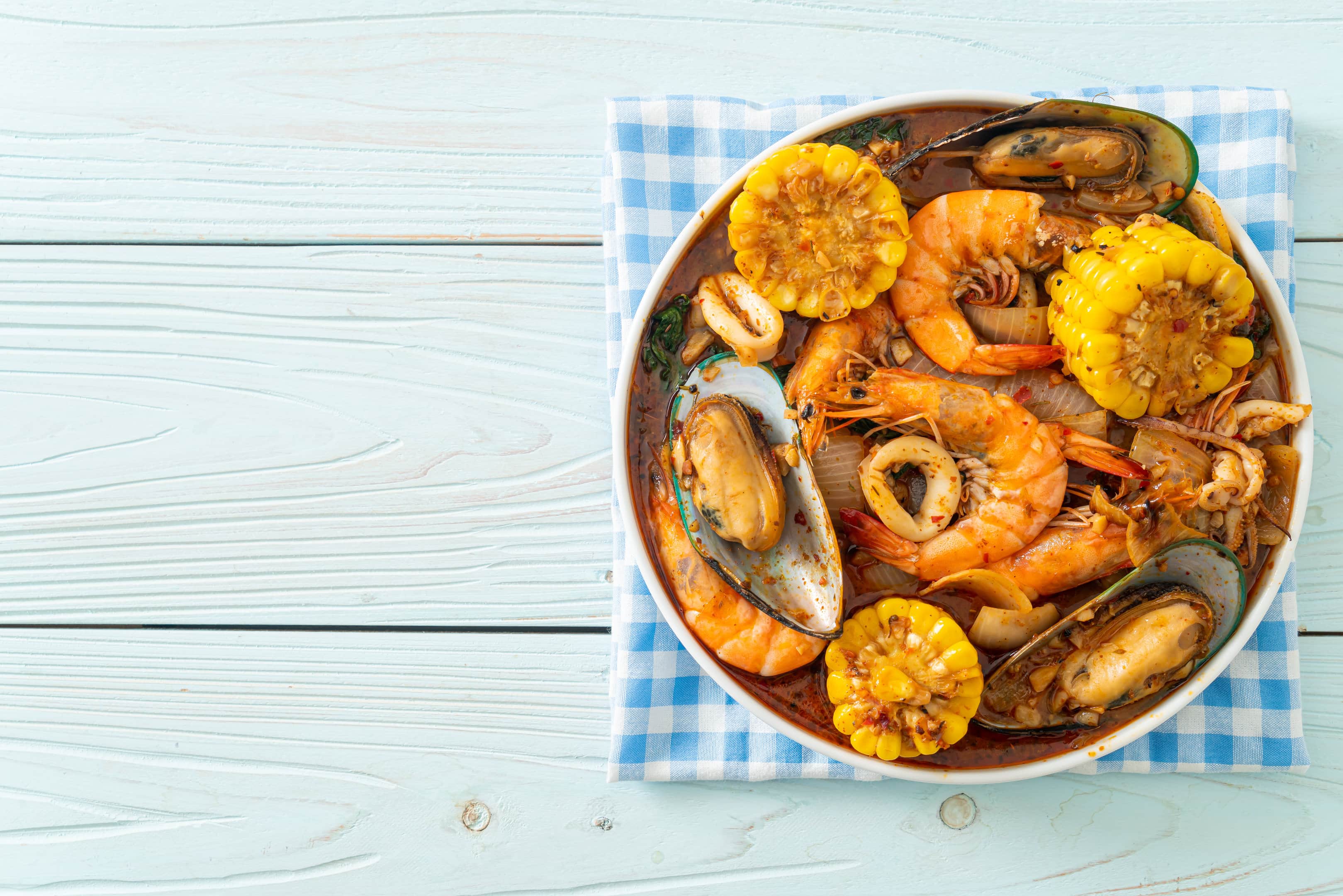 Spicy Boiling Crab shrimp with squid, mussels, and corn
