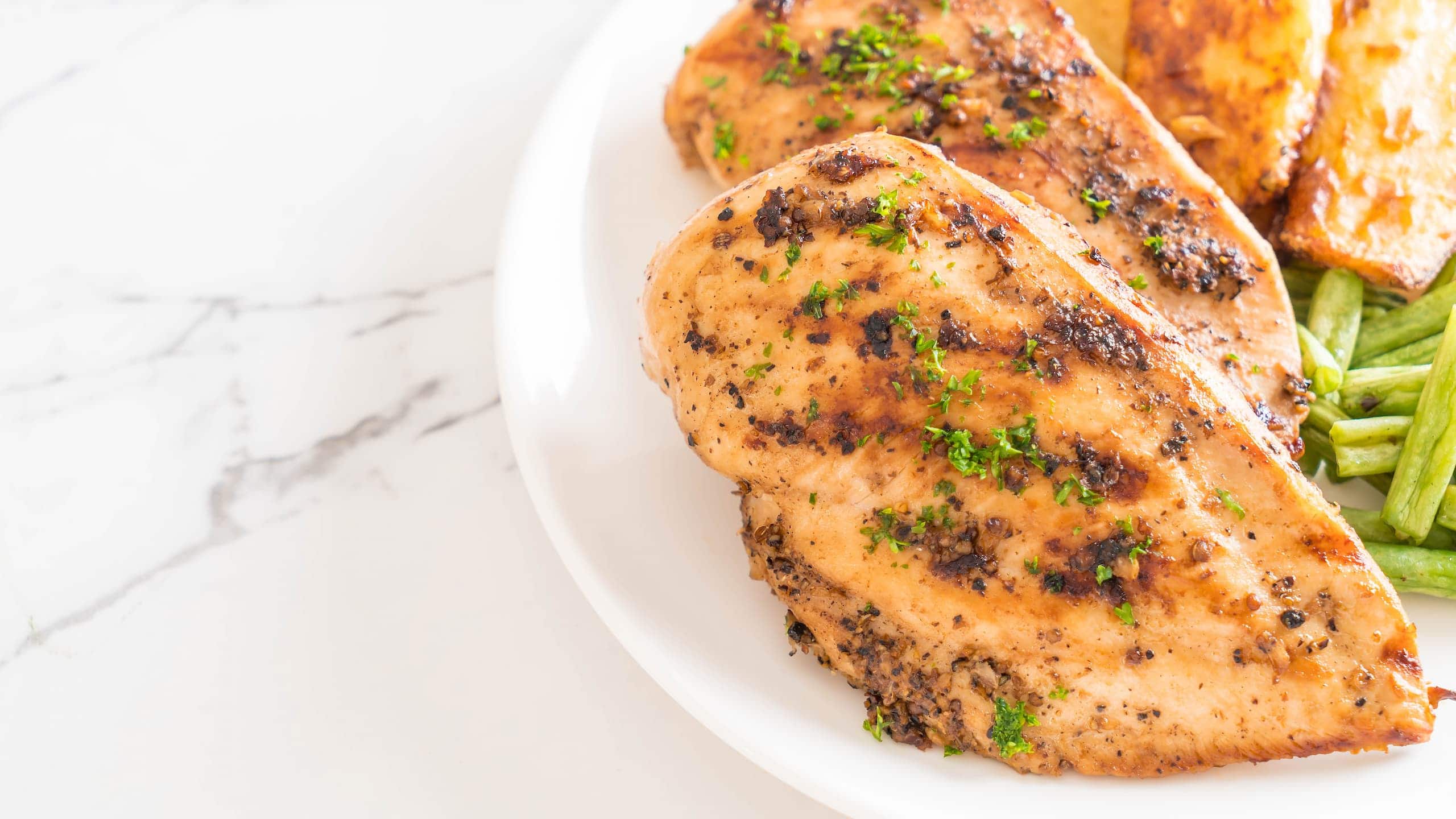 Texas Roadhouse herb crusted chicken with potatoes and beans