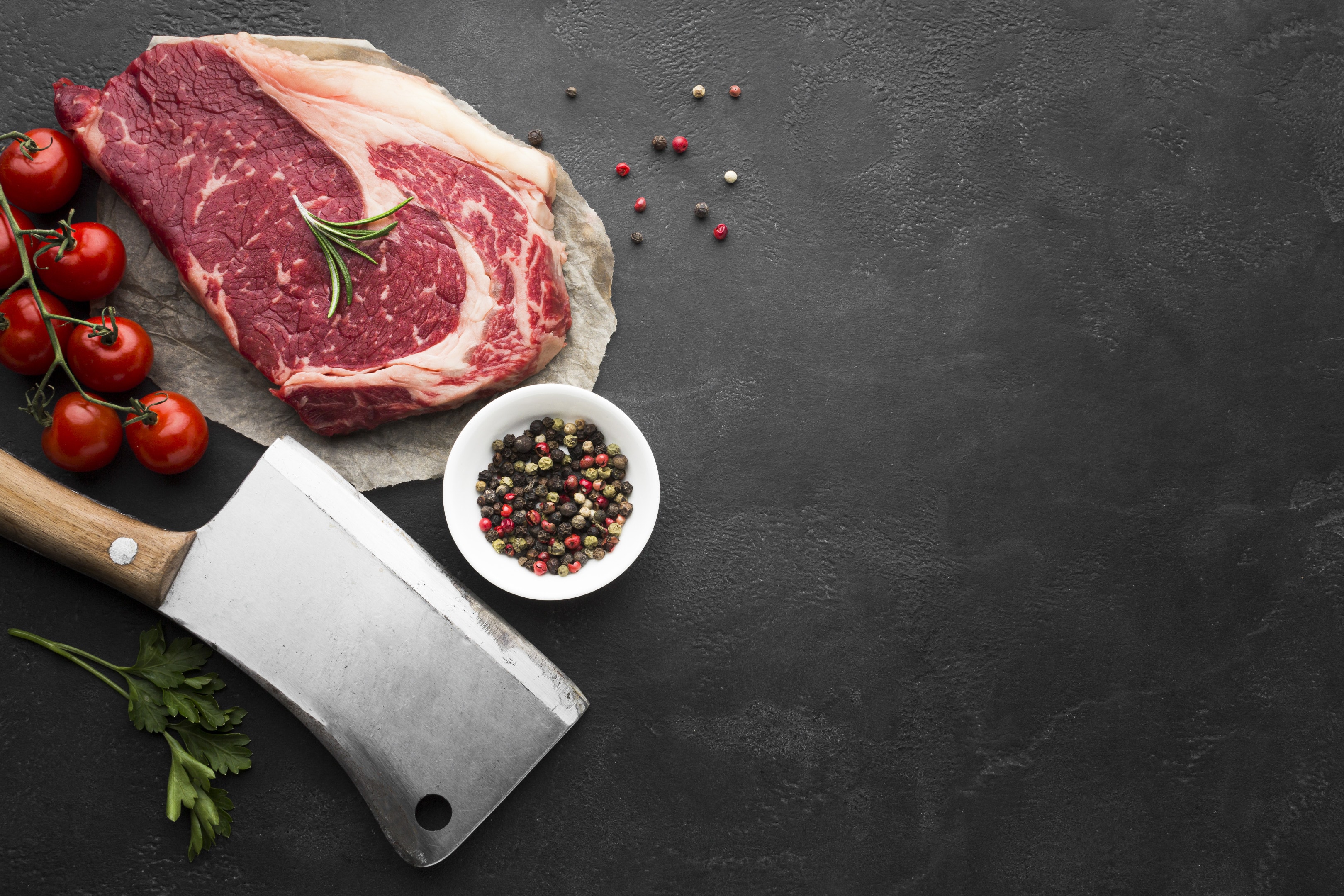 Fresh steak with tomatoes (top view)