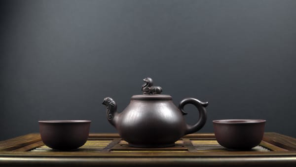 Ancient teapot with black soybean tea
