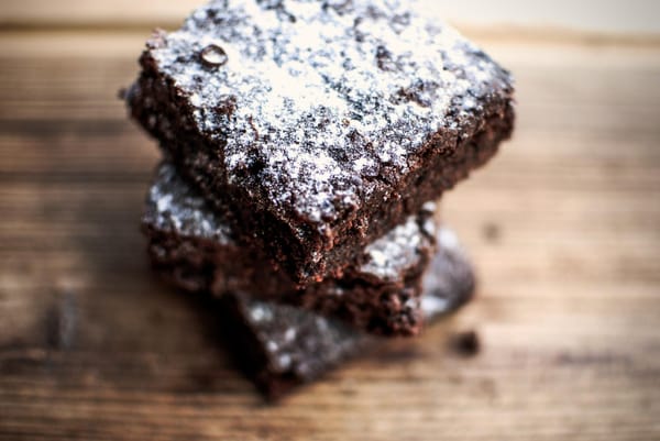 Chocolate brownie dusted with powdered sugar
