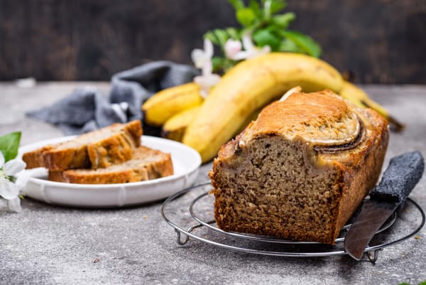 Sliced Betty Crocker's banana bread with fresh bananas