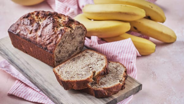 Ina Garten banana bread loaf with slices and bananas