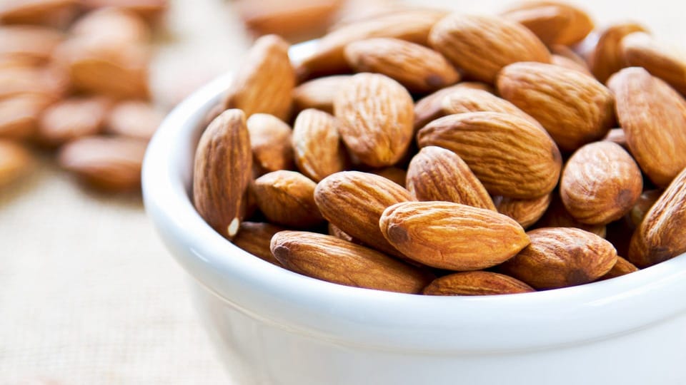 Almonds in a white bowl