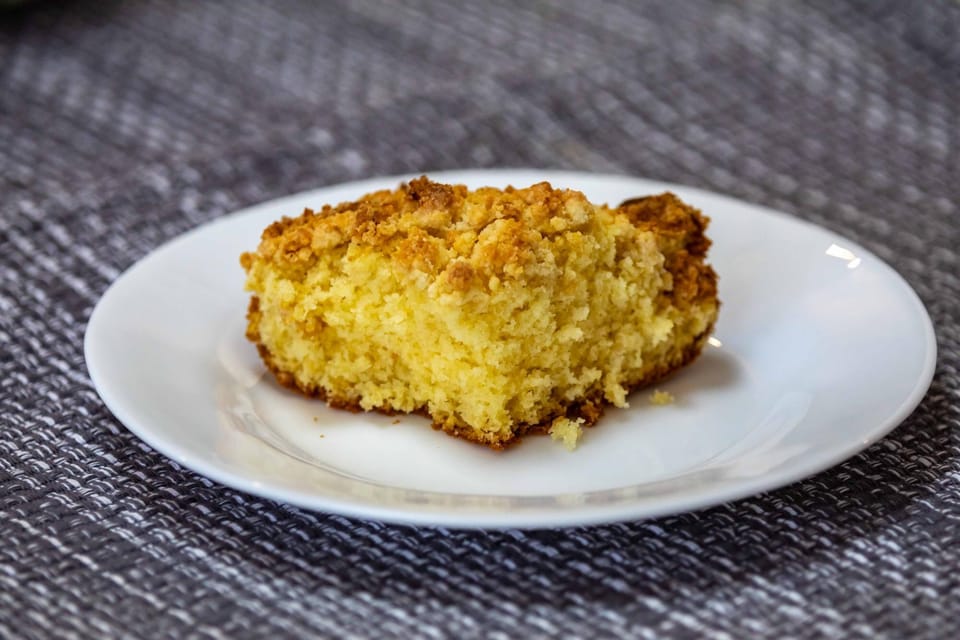 Slice of cornbread on a white plate