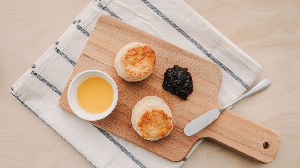 Homemade Hardee's biscuits with fruit jam and sweet butter dip