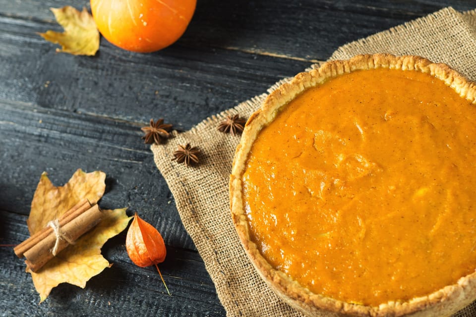 Classic pumpkin pie on a rustic table