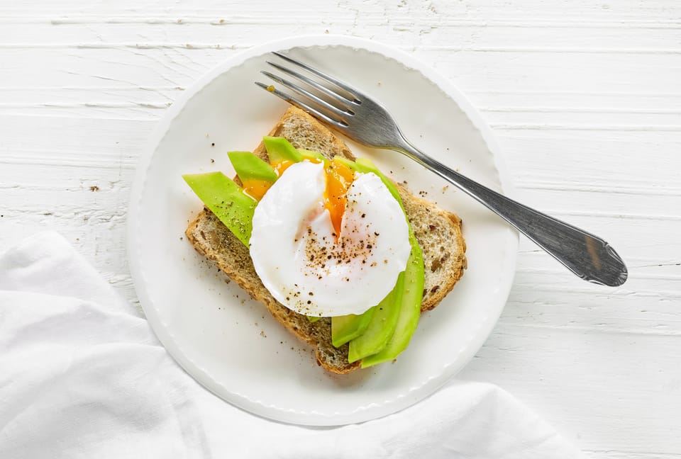 Sandwich with avocado and poached egg
