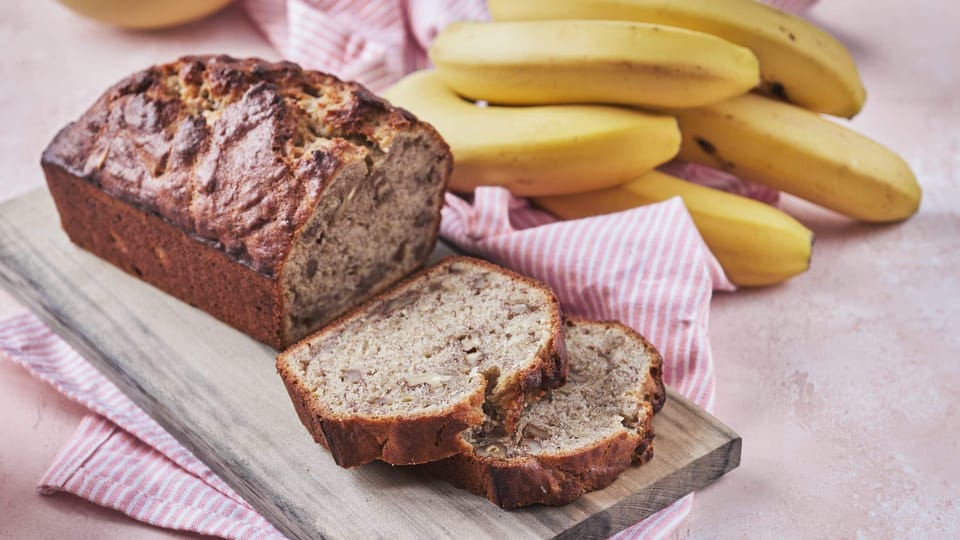 Ina Garten banana bread loaf with slices and bananas