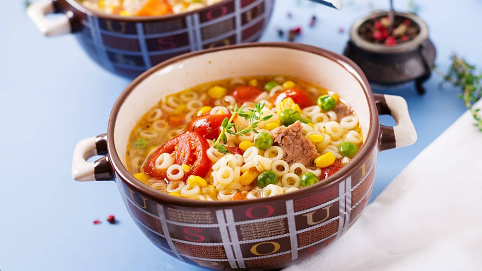 Two bowls of Italian busy day soup with spices