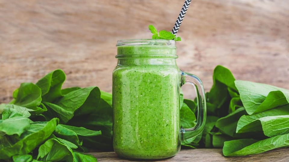 ultimate meal replacement smoothie filled with spinach, banana, and coconut milk