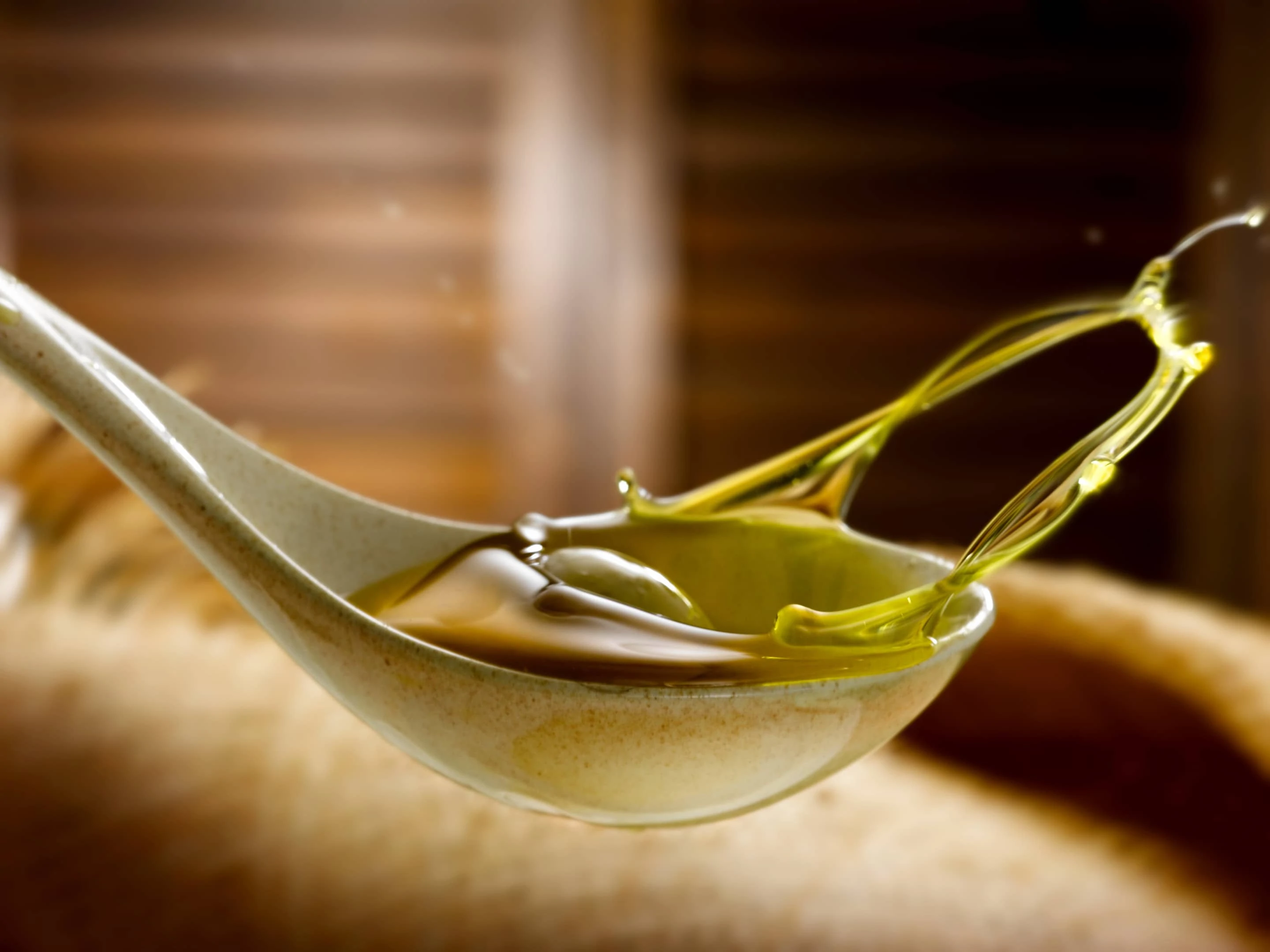 Spoon of extra virgin olive oil