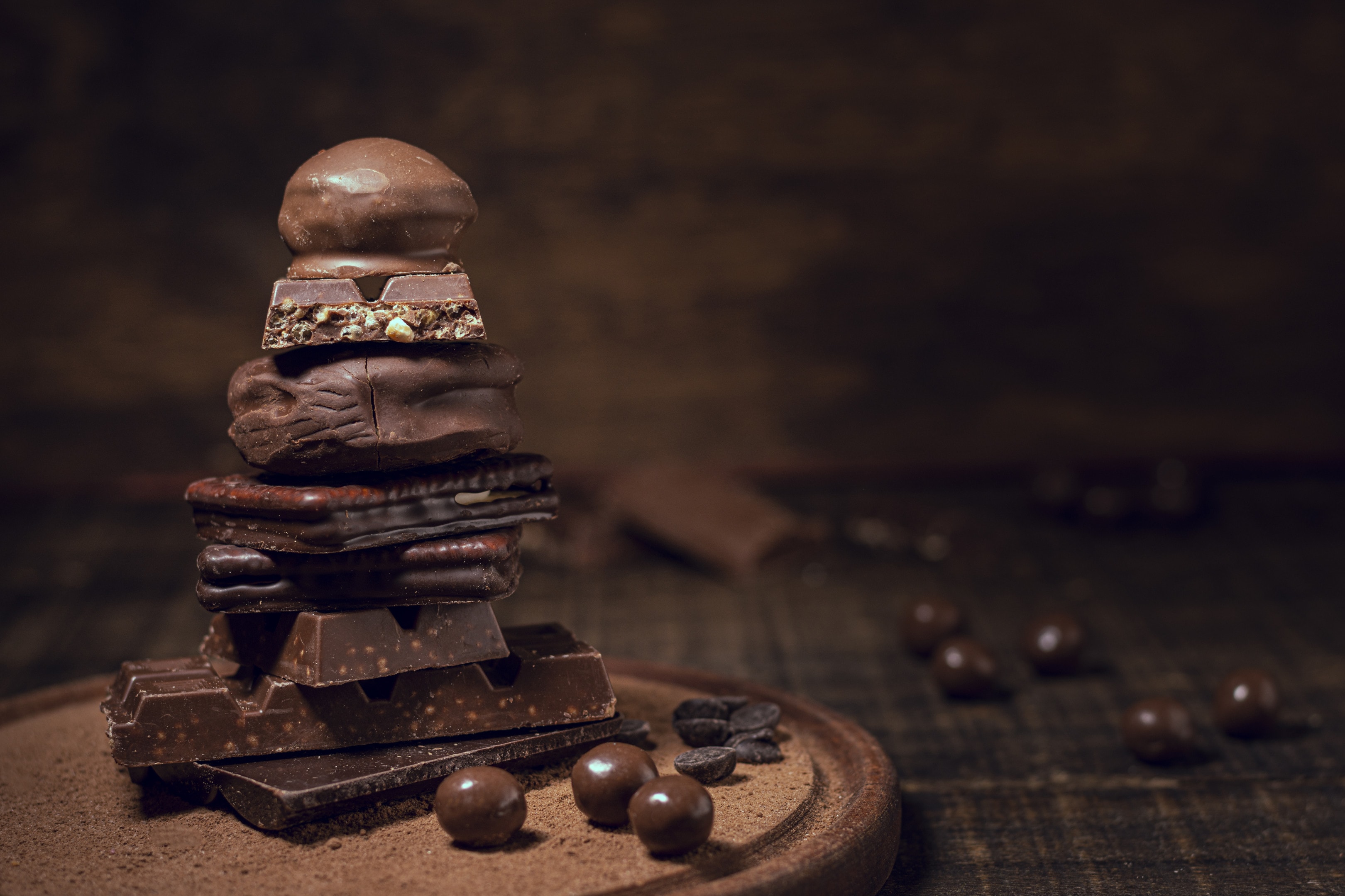 Chocolate pyramid on wooden board