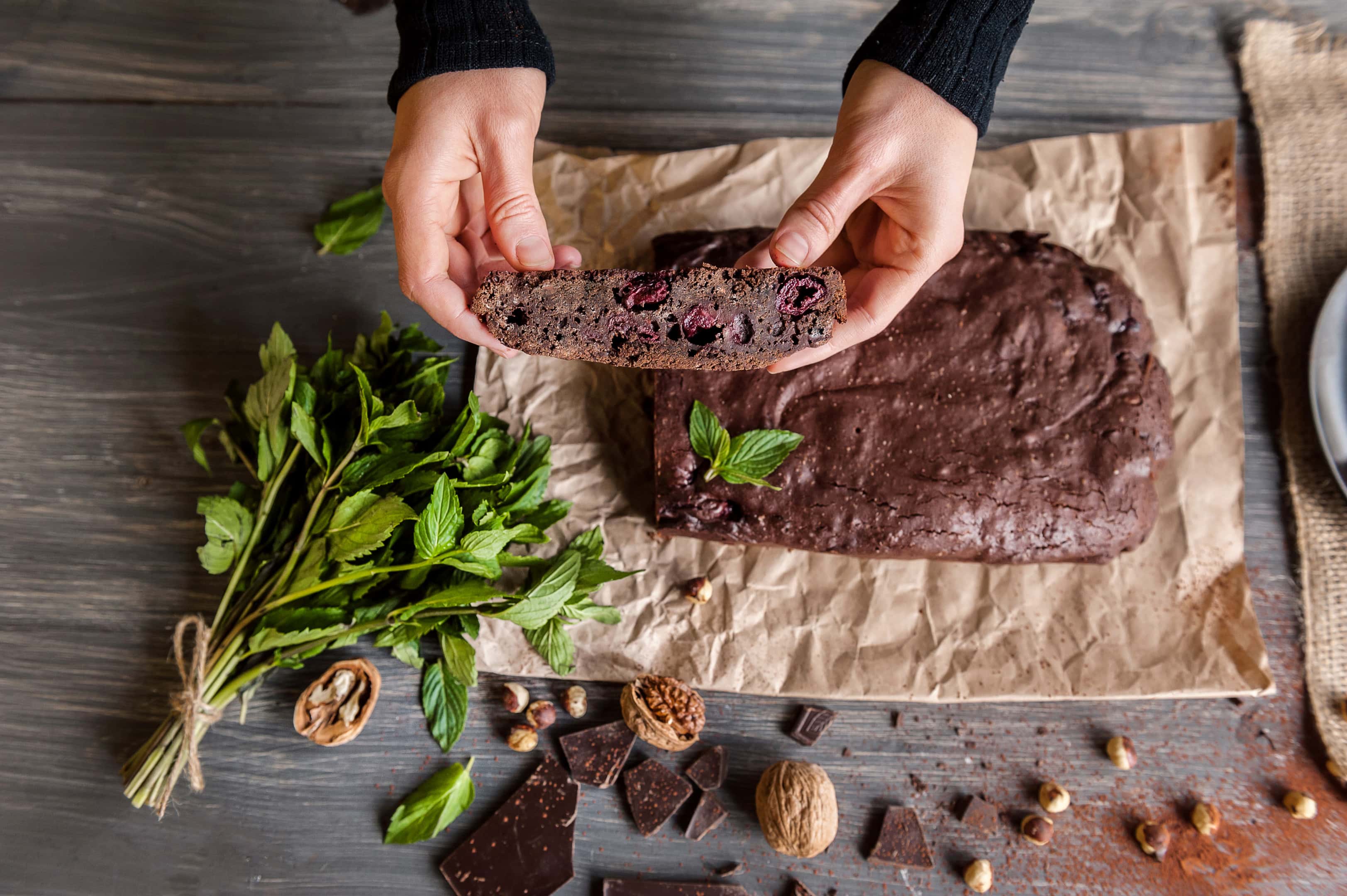 Cutting homemade chocolate chickpea brownie vegan and gluten-free