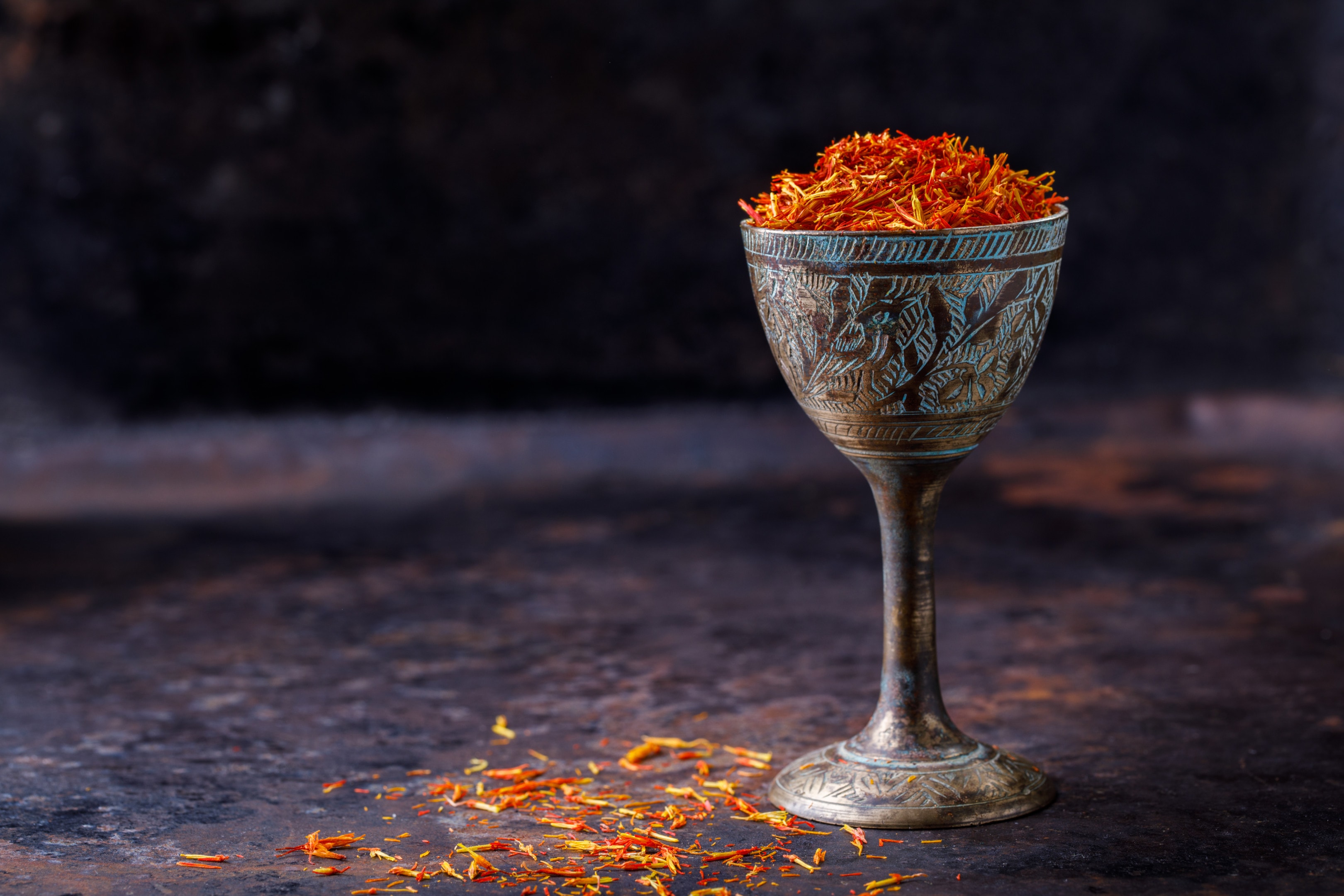 Dried saffron spice in metal glass