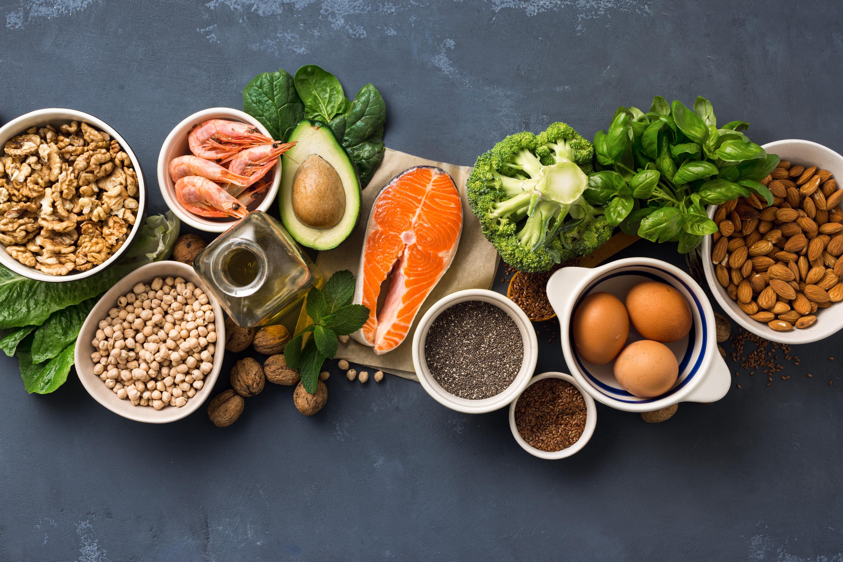 Healthy Food sources on dark background top view.
