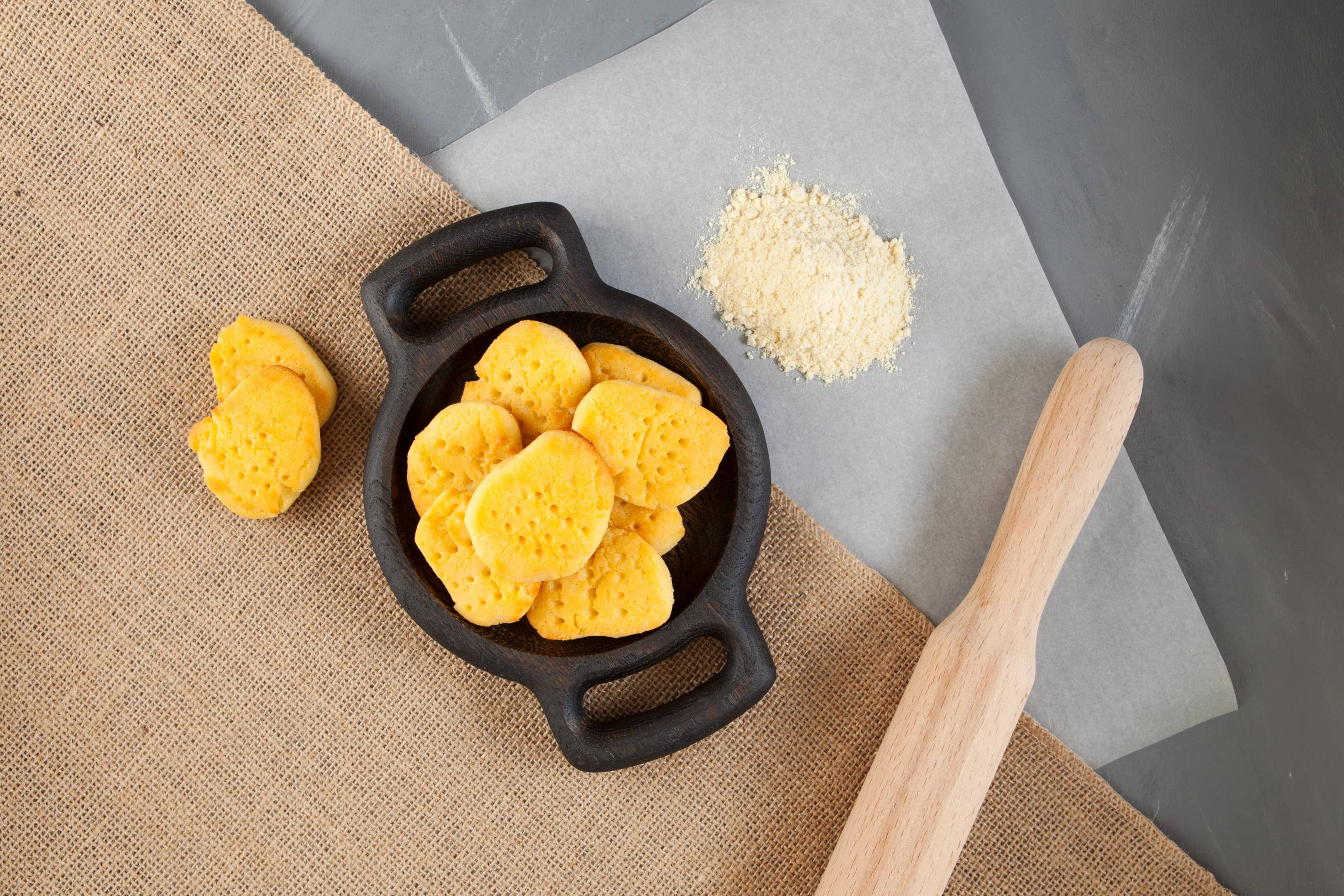 Chickpea Flour Biscuits - Vegan and Gluten-Free. Flour on baking paper and rolling
