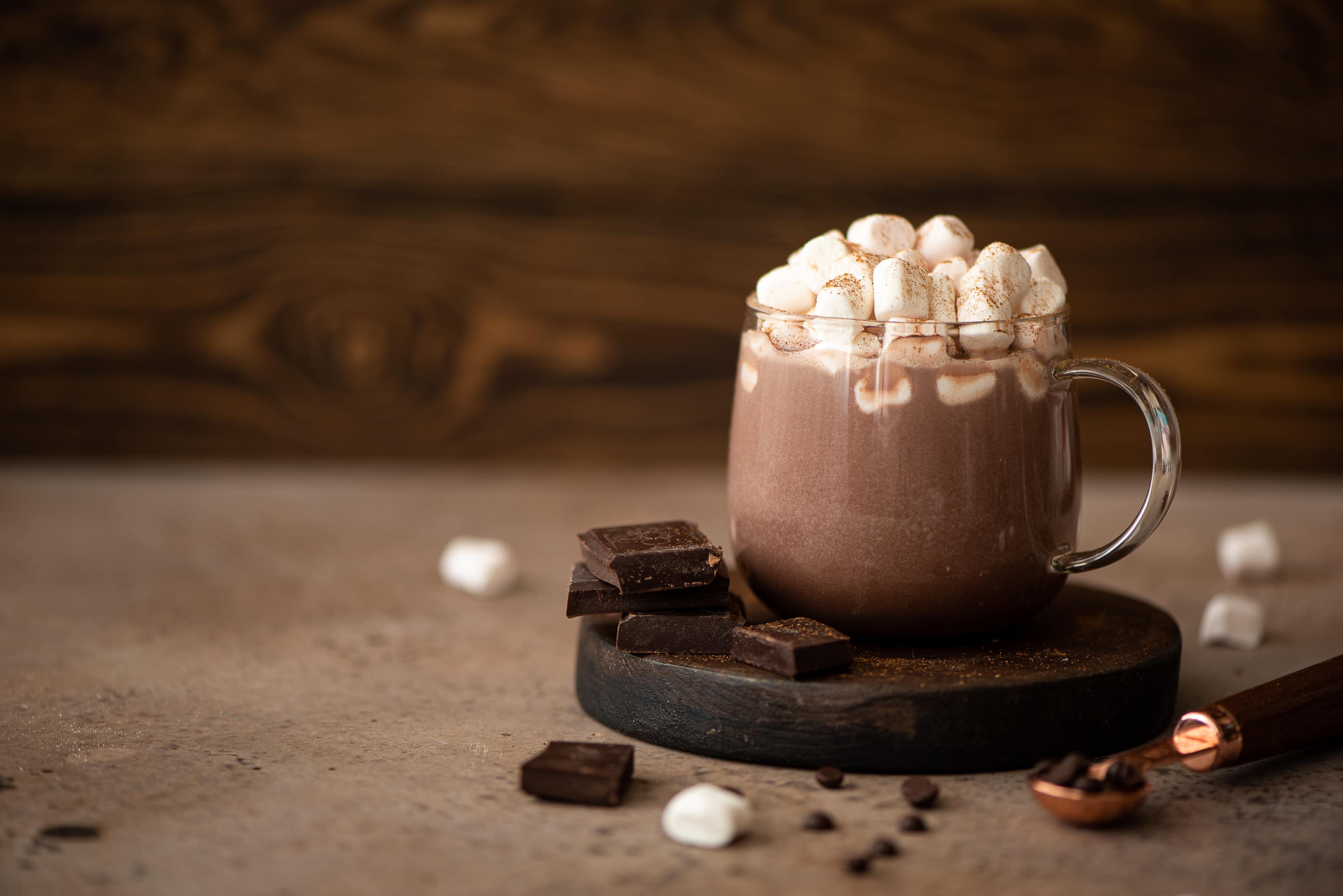 hot chocolate cocoa with marshmallow in a glass mug