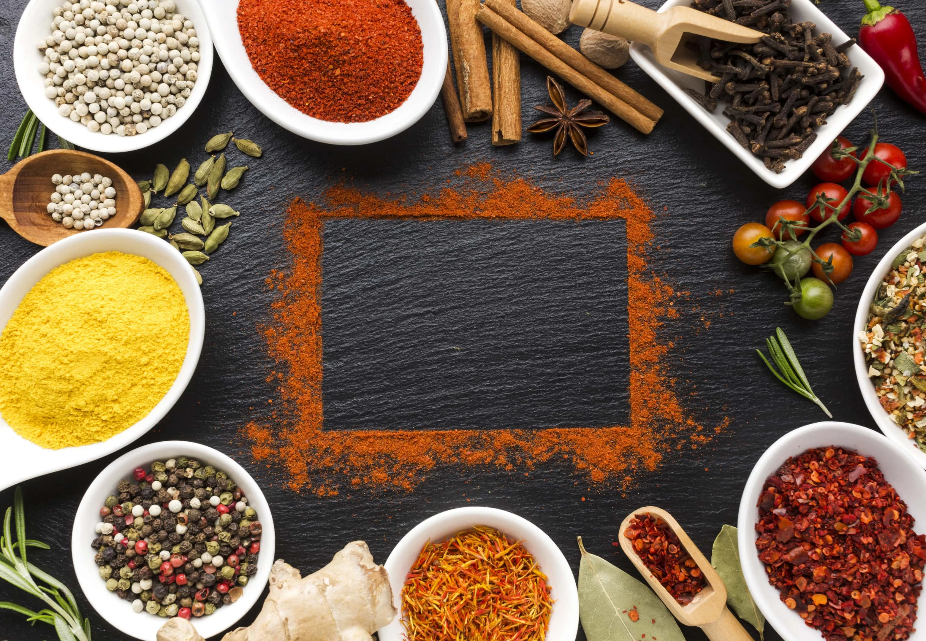 Mixture of spices and powder of spice mixture on table