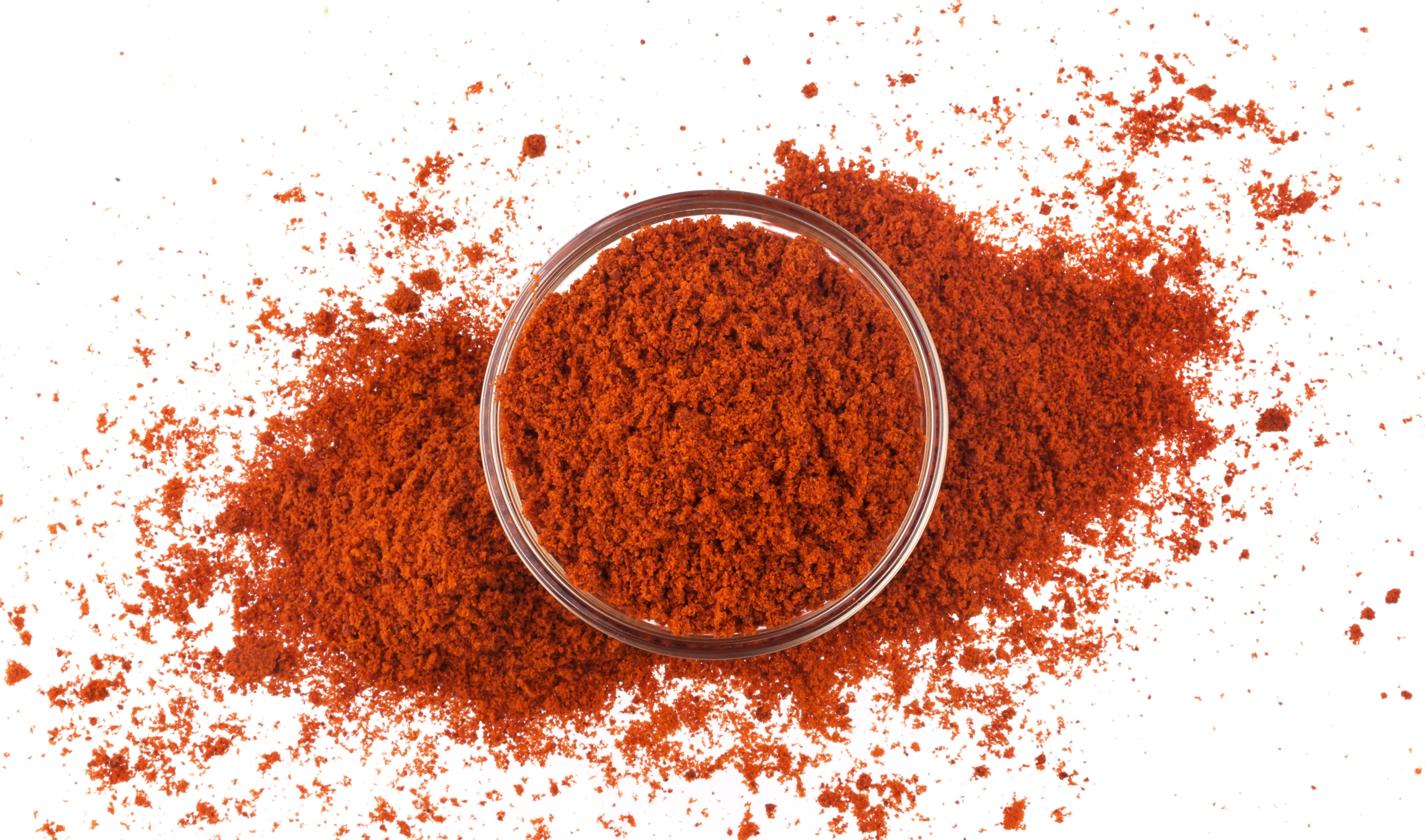 Red paprika powder in bowl