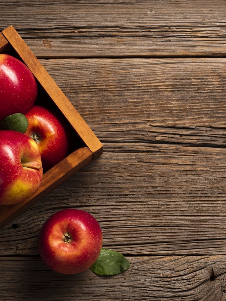 Ripe apples in wooden crate