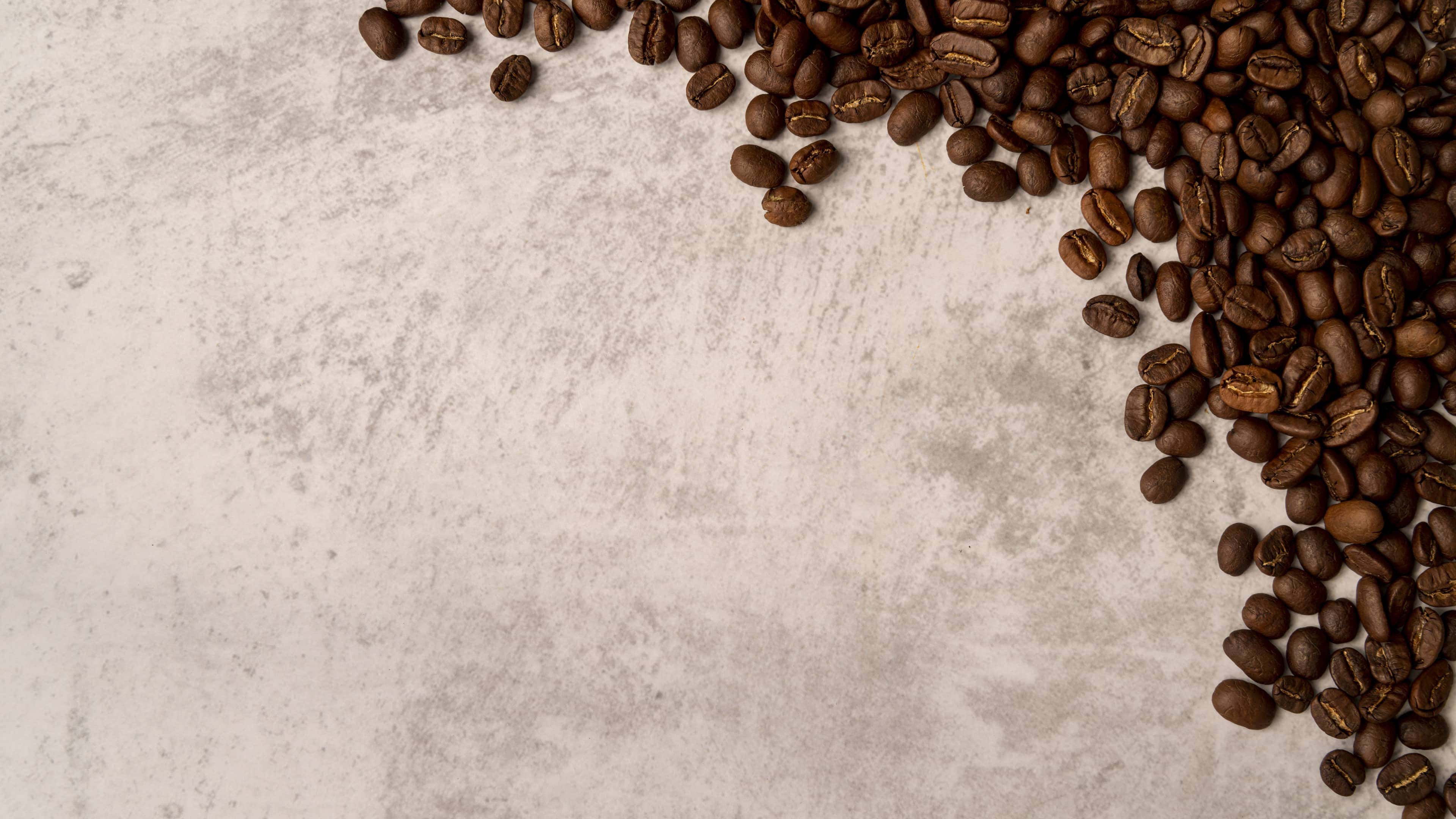 Roasted coffee beans on bright background