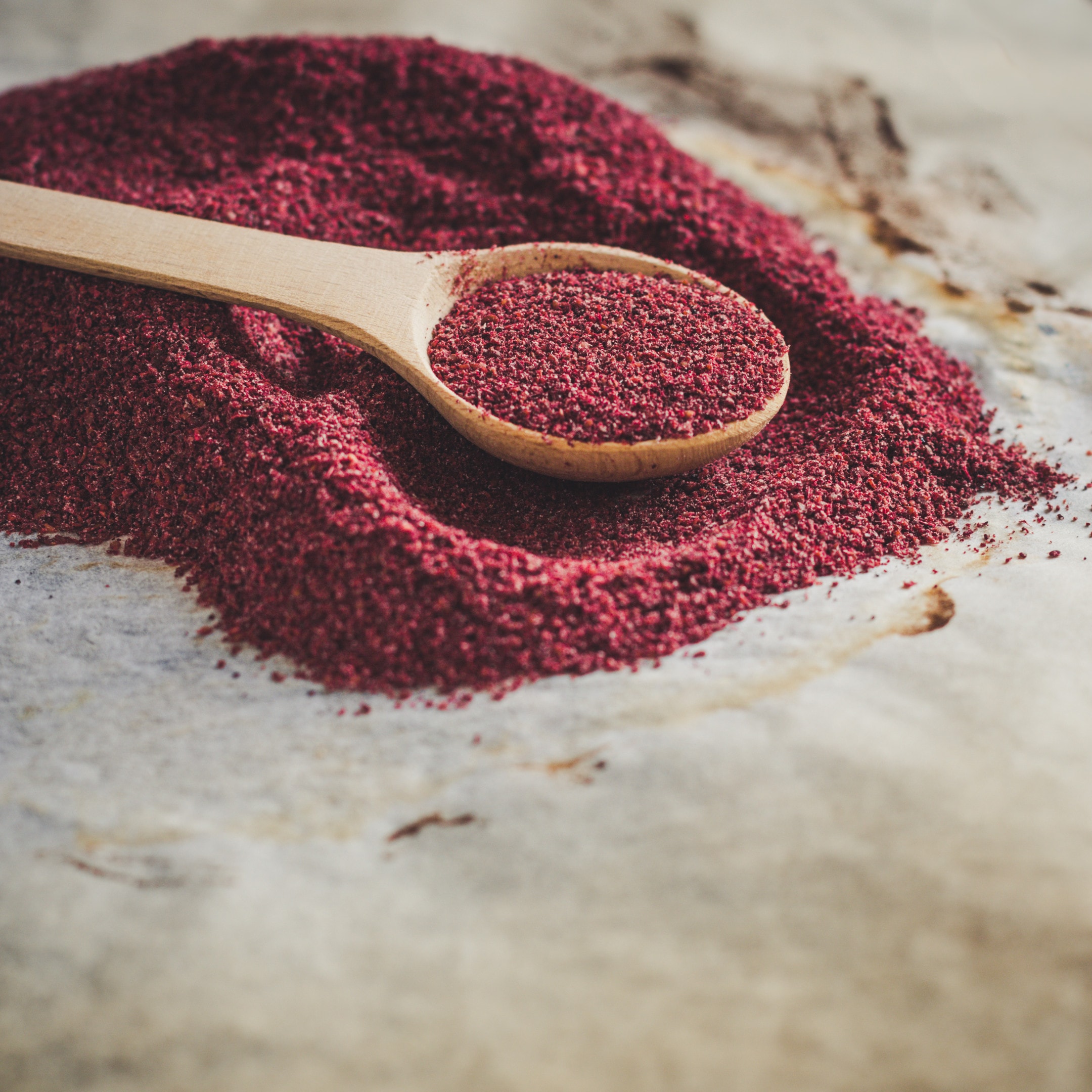 Sumac spice-with wooden spoon
