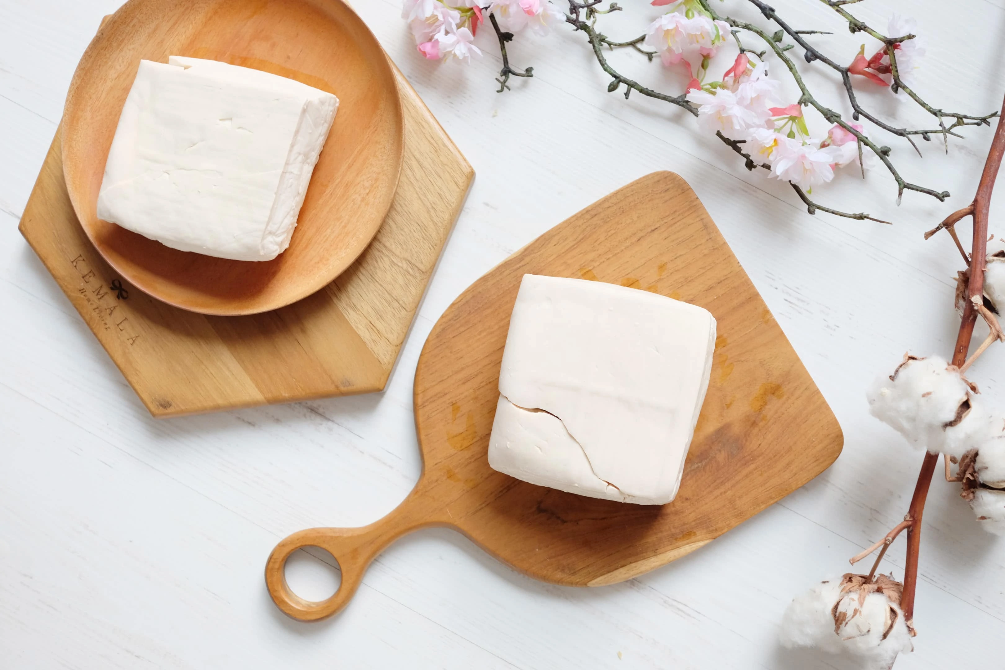 White raw tofu on wooden board