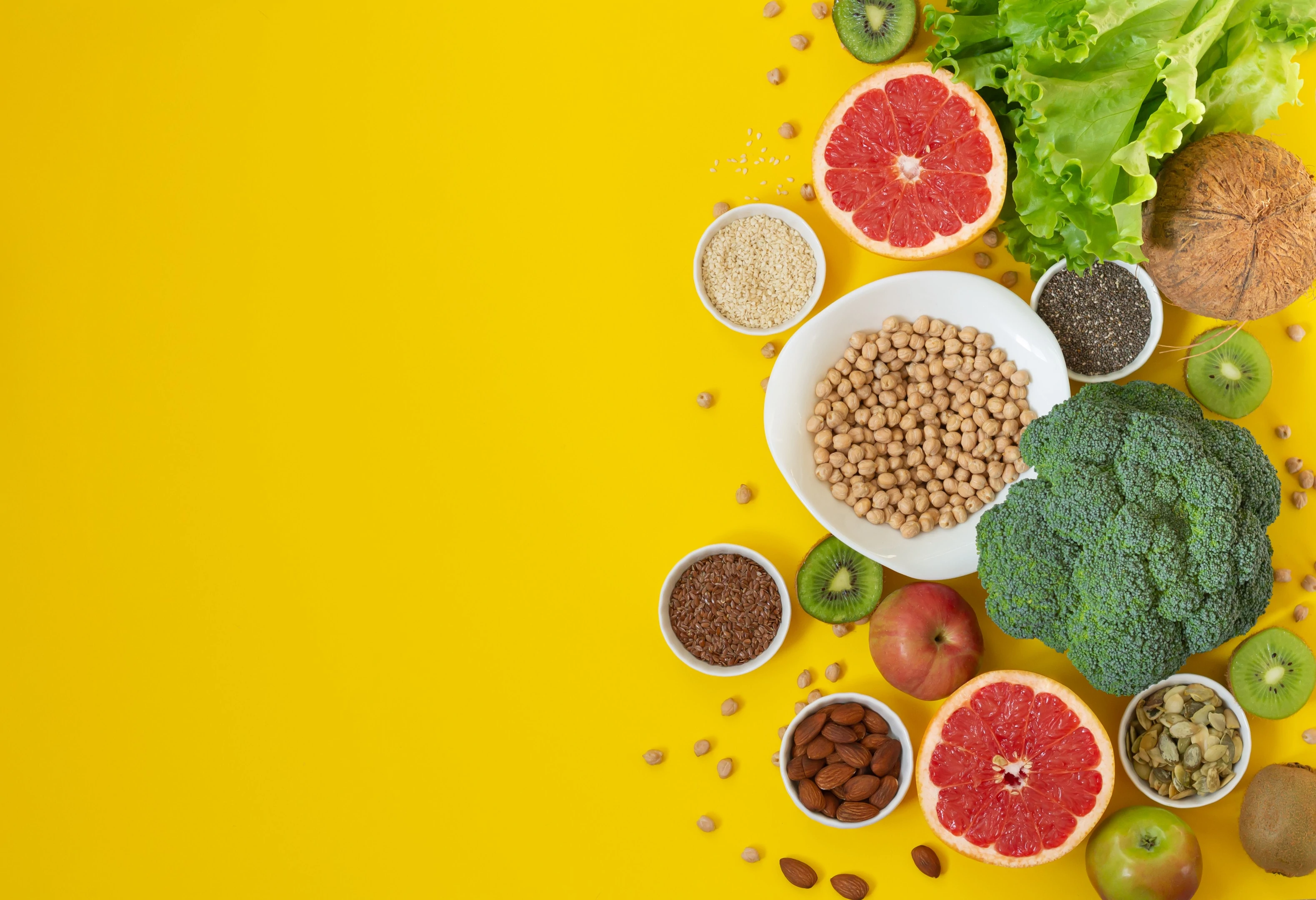 Food rich in antioxidants and fiber on yellow background