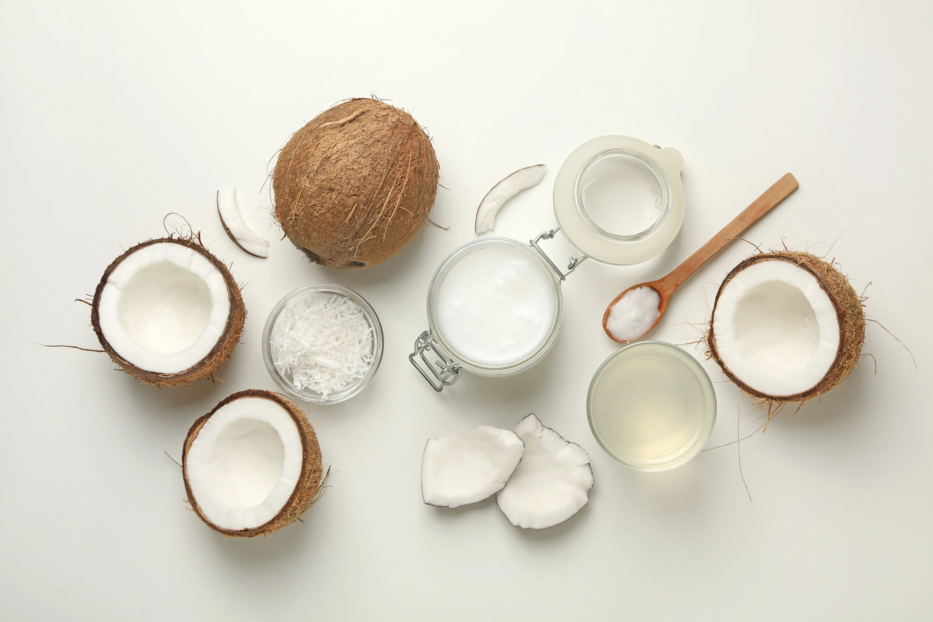 Fresh coconut and coconut water on white background