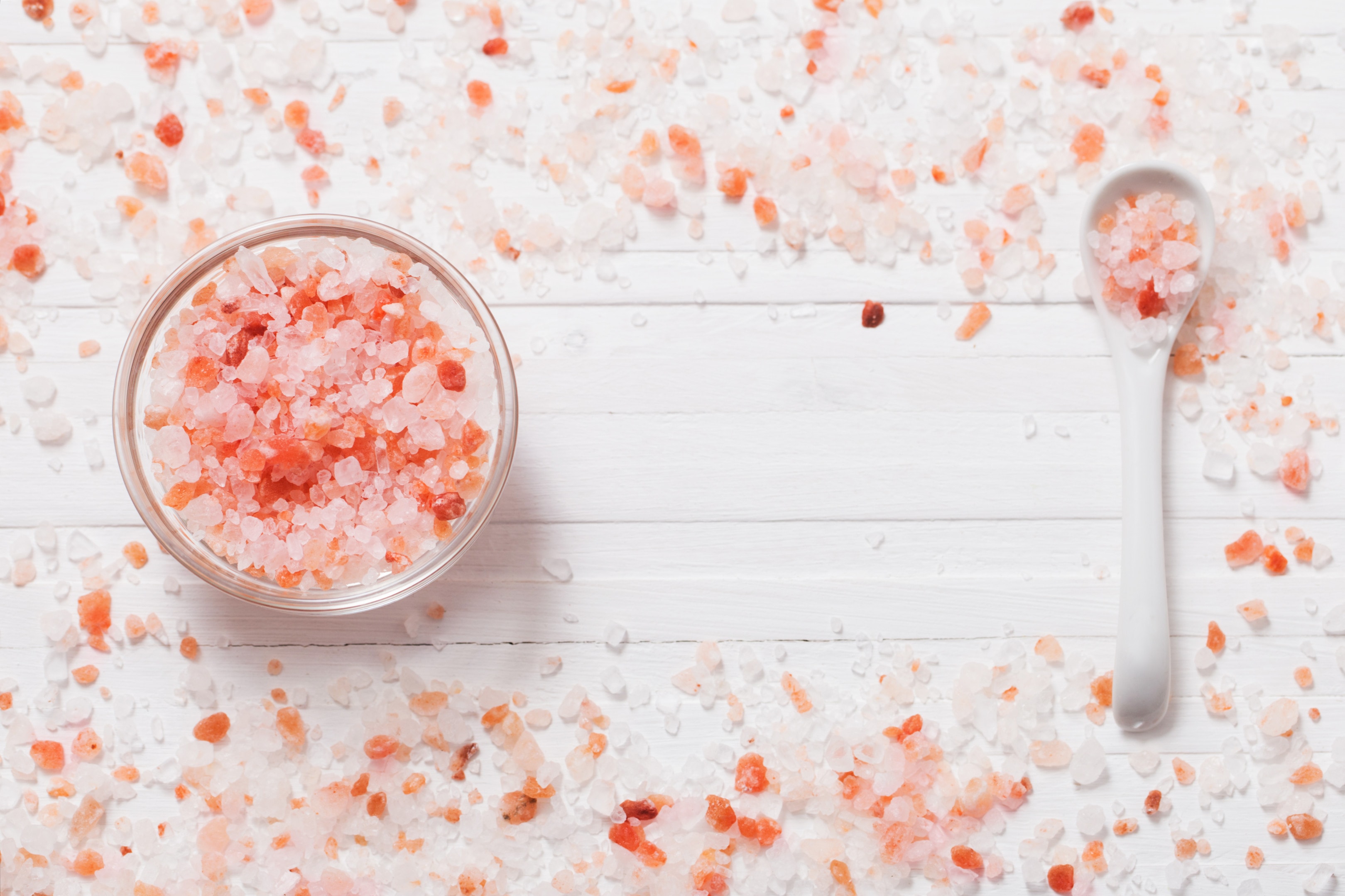 Himalayan salt on white wooden background