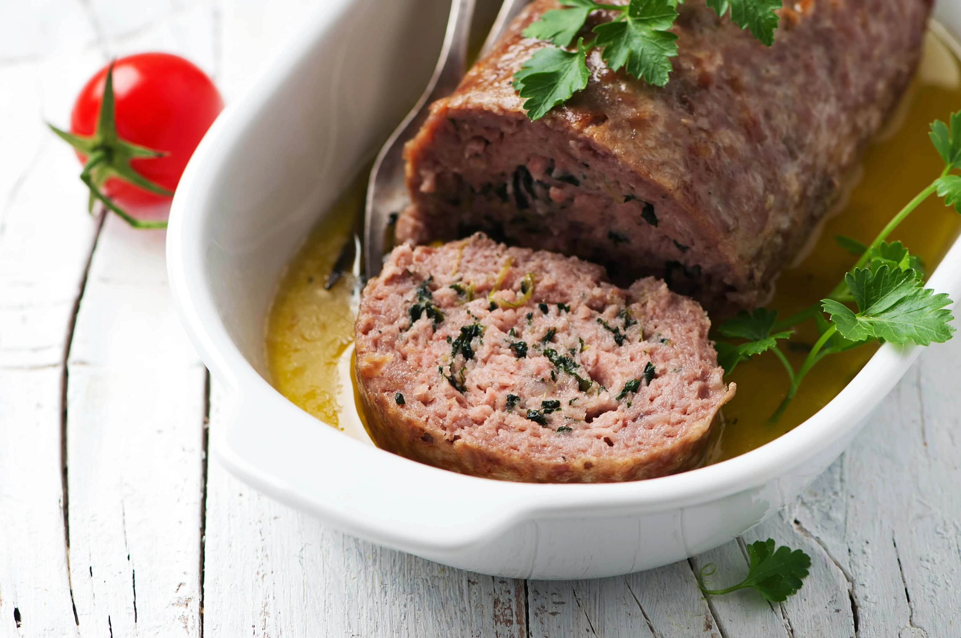 Meatloaf with herbs in ceramic plate