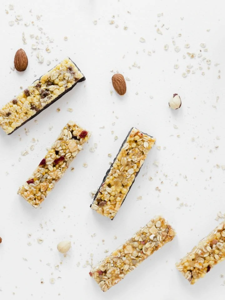 Protein bars with oats nuts on white table