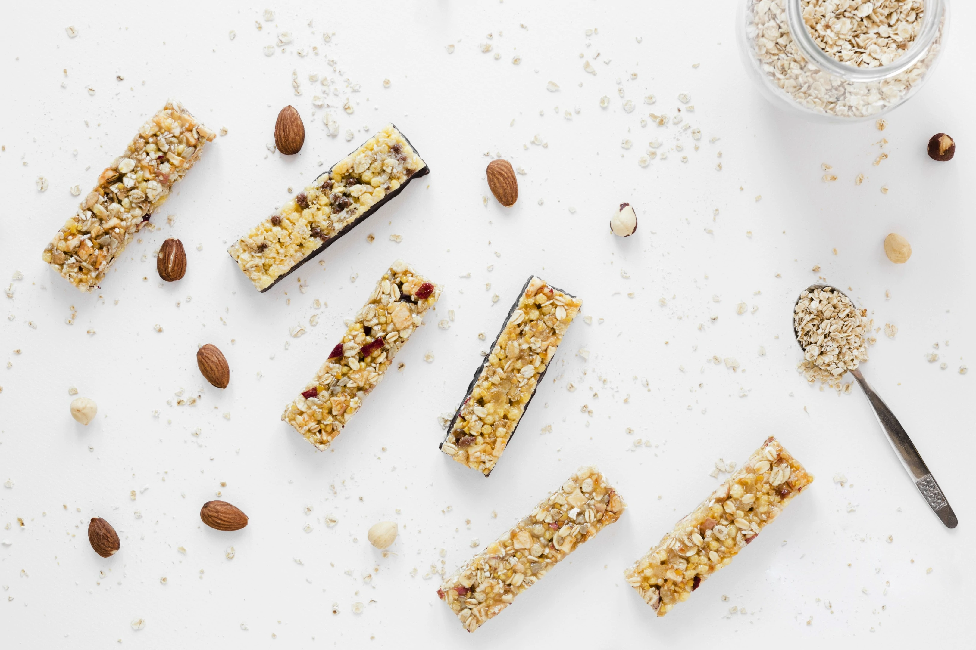 Protein bars with oats nuts on white table