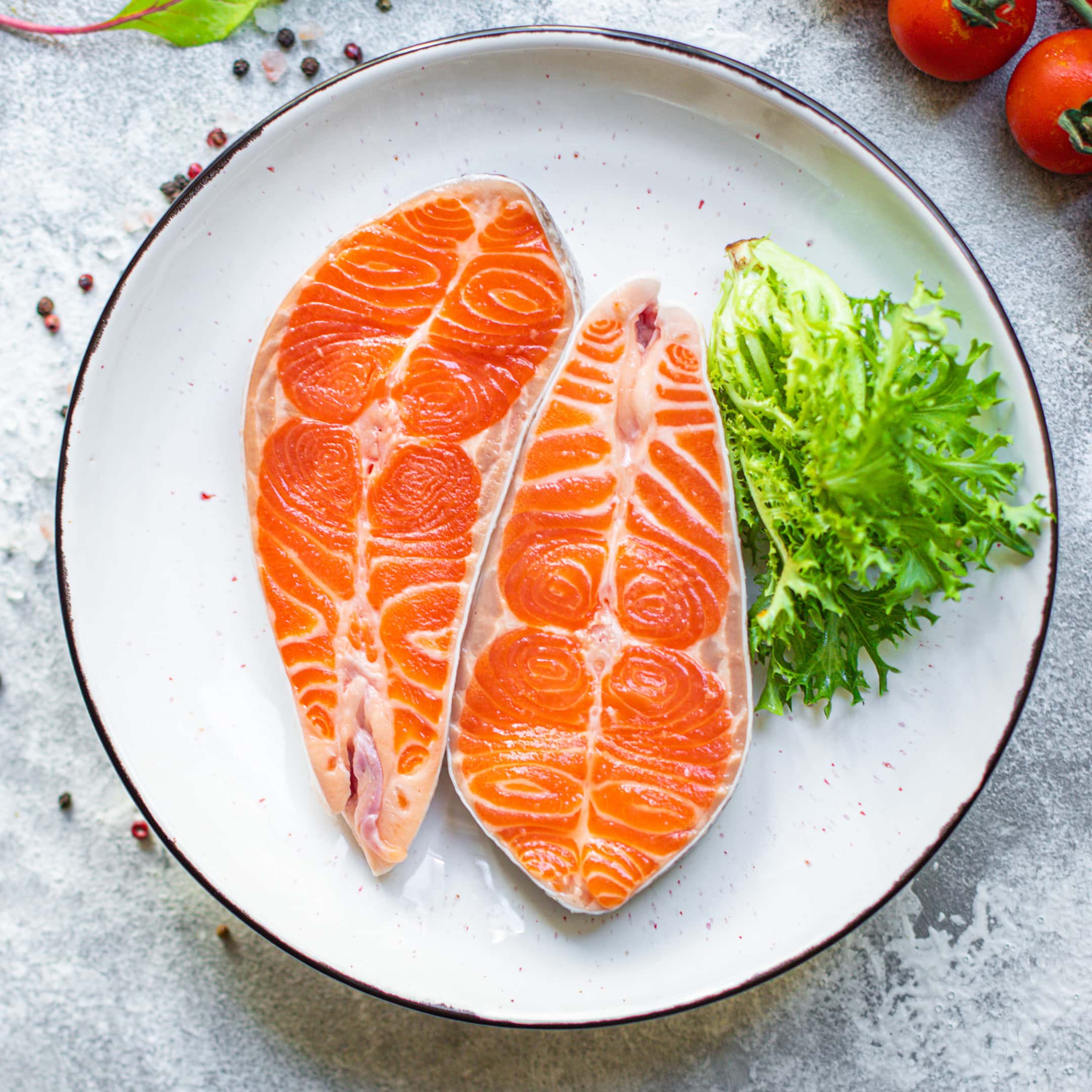 Salmon fish raw steak fillet on ceramic plate