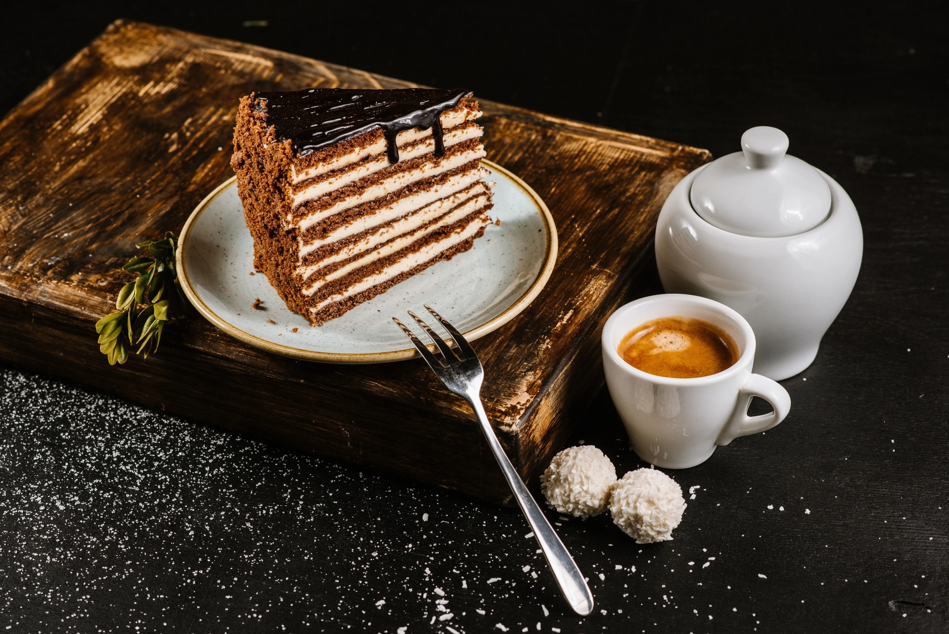 A piece of chocolate and cream cake with espresso